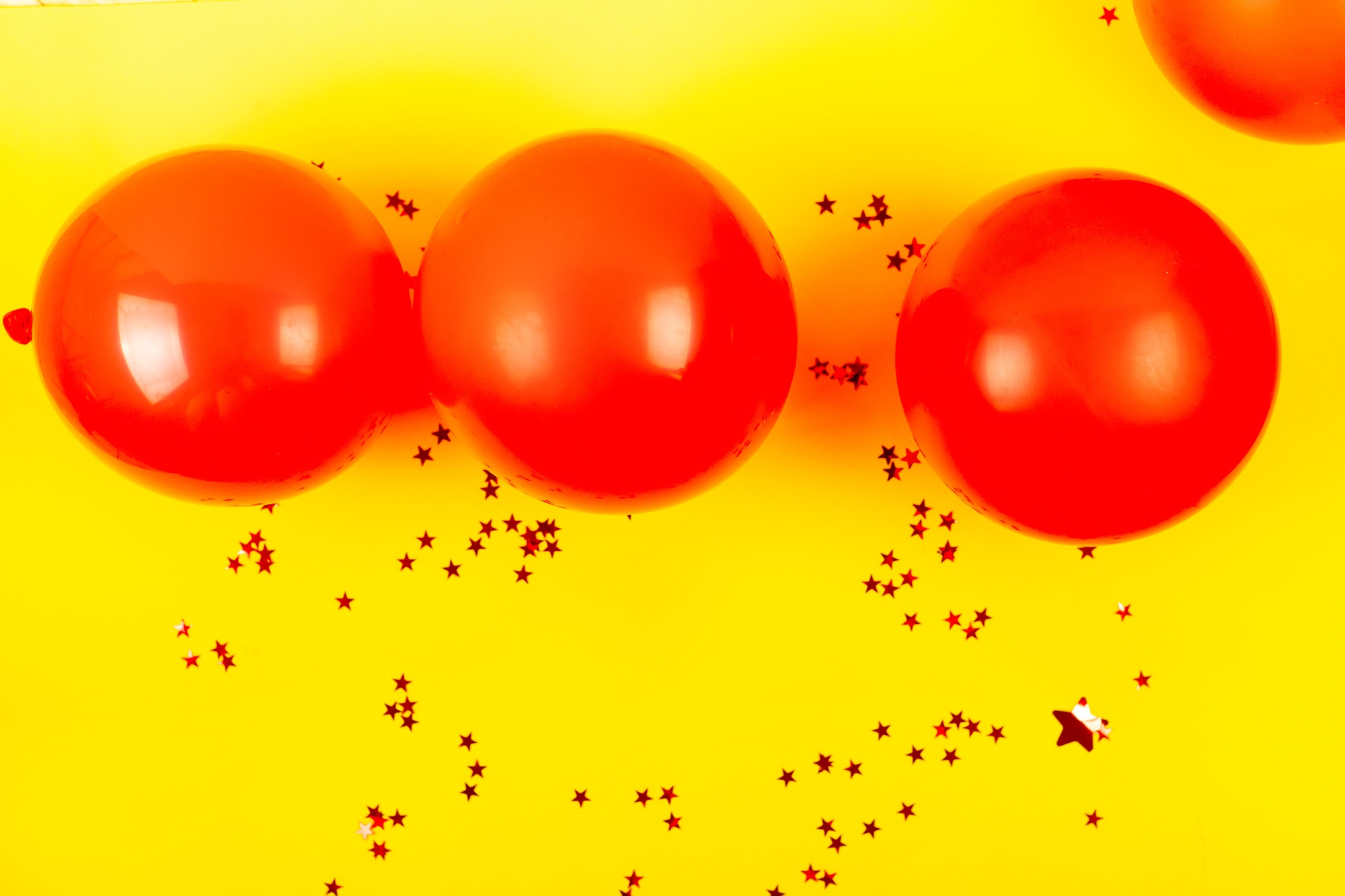 Banner with red air Balloons and sparkles on yellow Background. greeting card for birthday