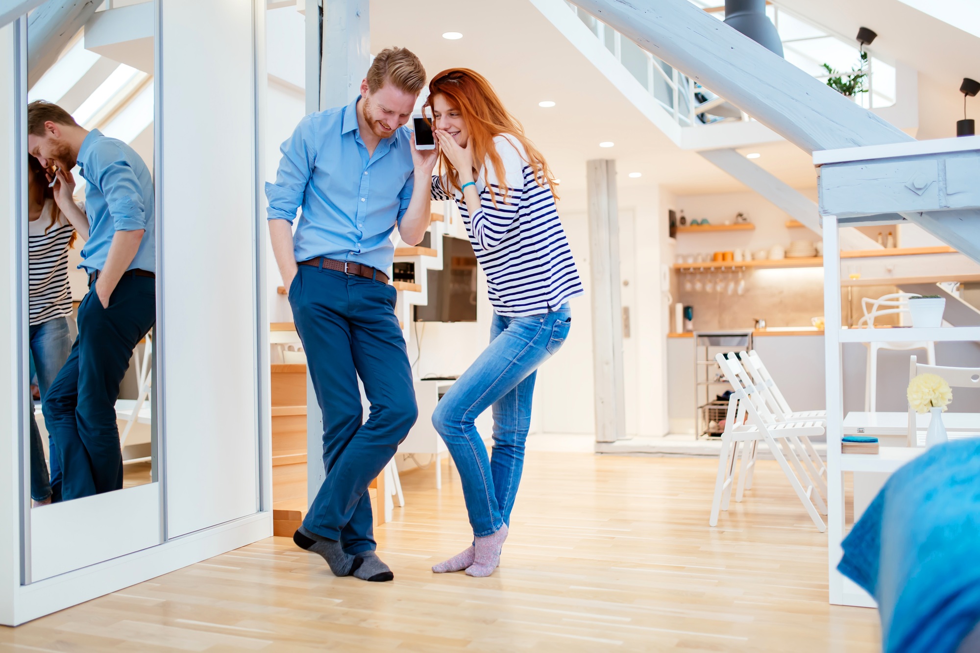 Beautiful couple in gorgeously designed apartment