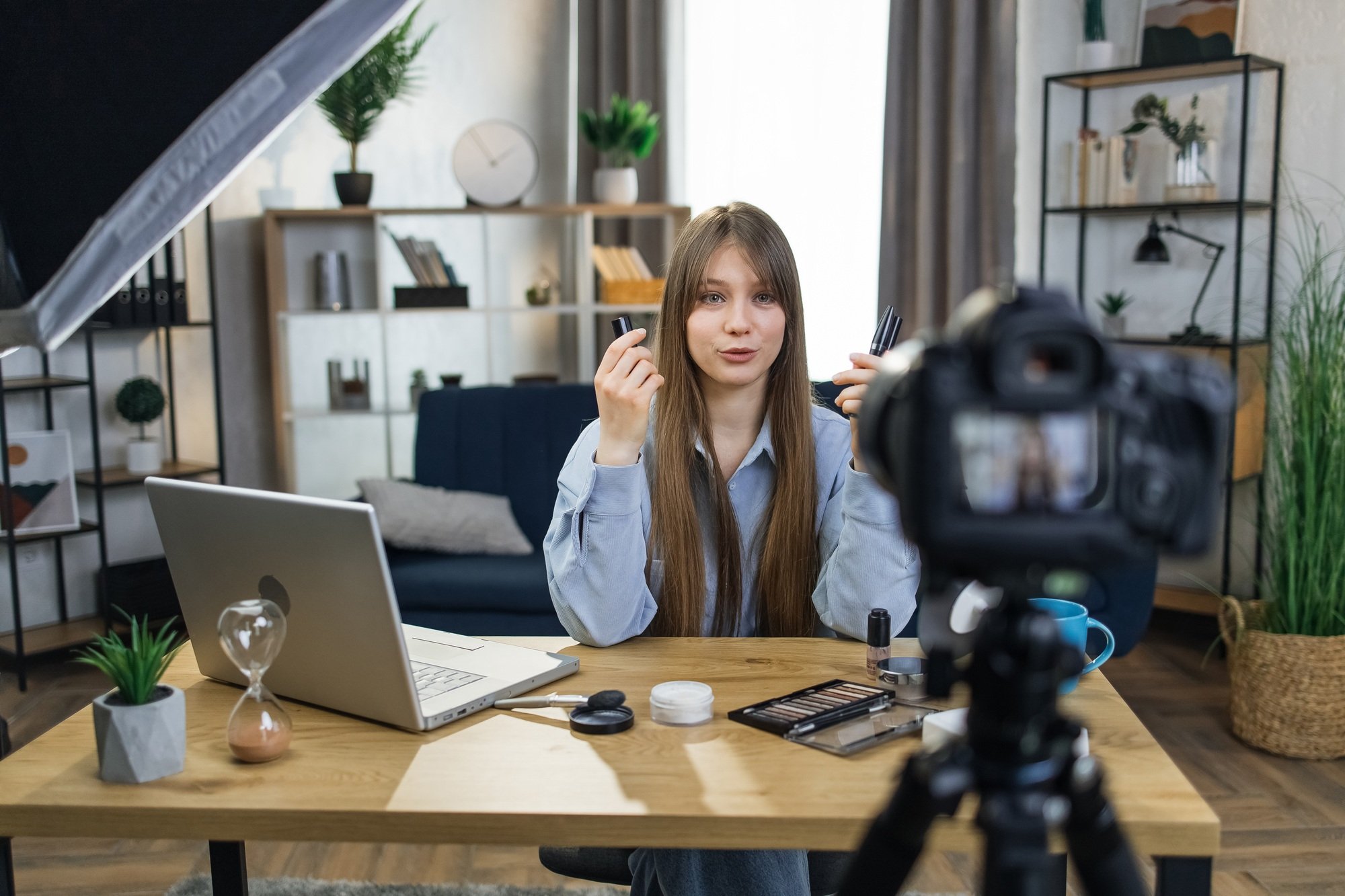 Beauty blogger recording video while testing new cosmetics