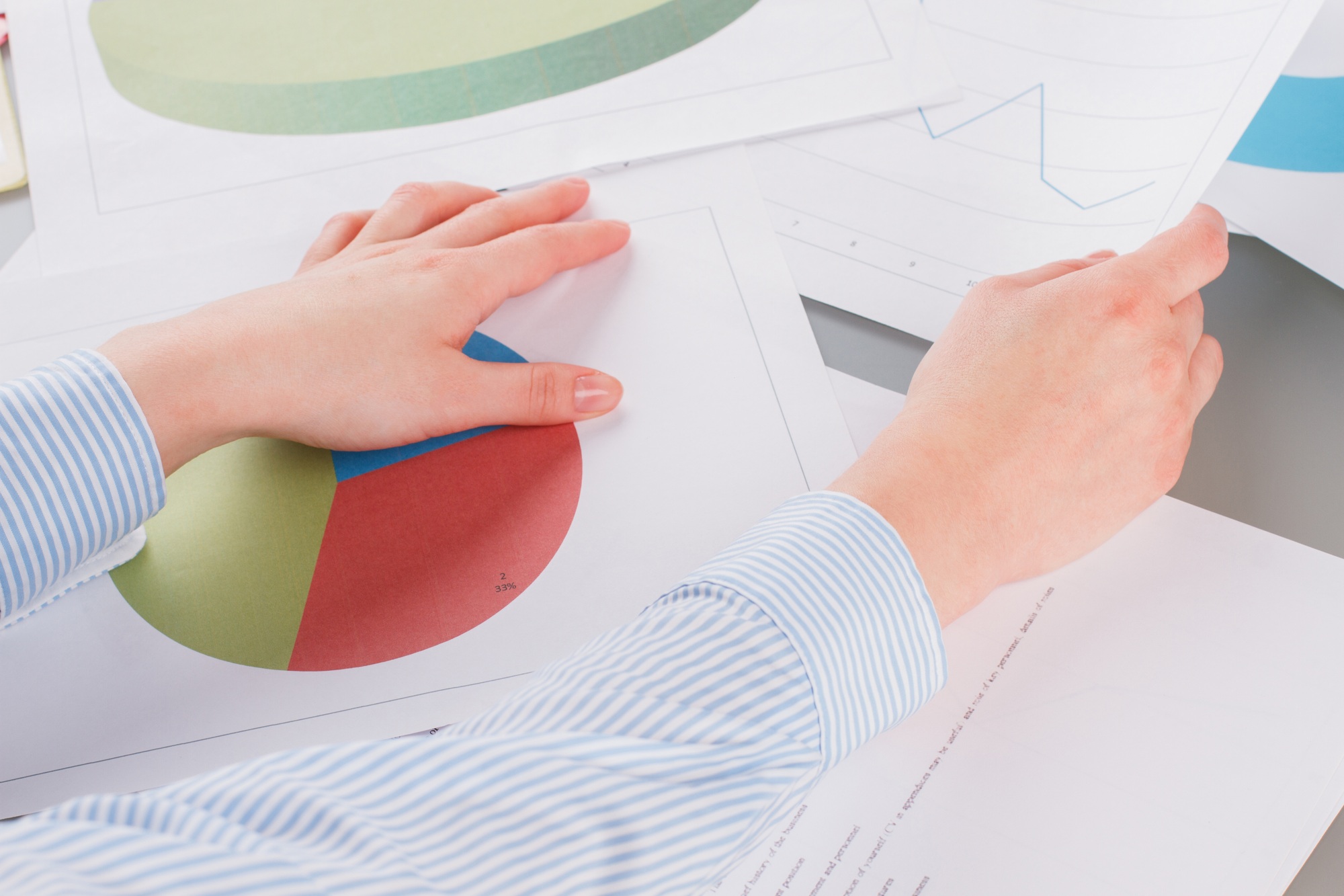 Business woman analysing graphs and charts.