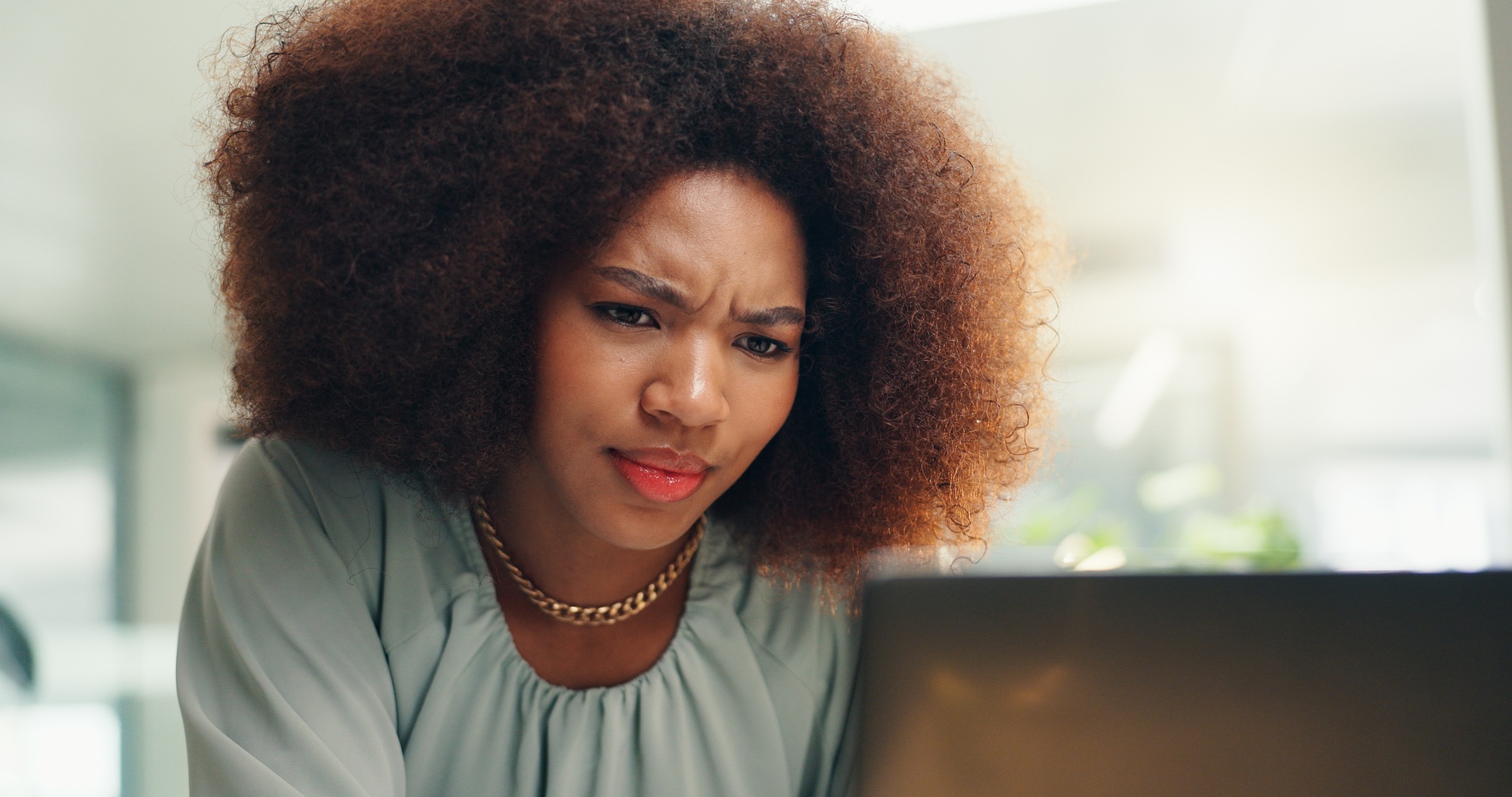 Business woman, laptop and doubt for press release with problem solving and confused in office. Web