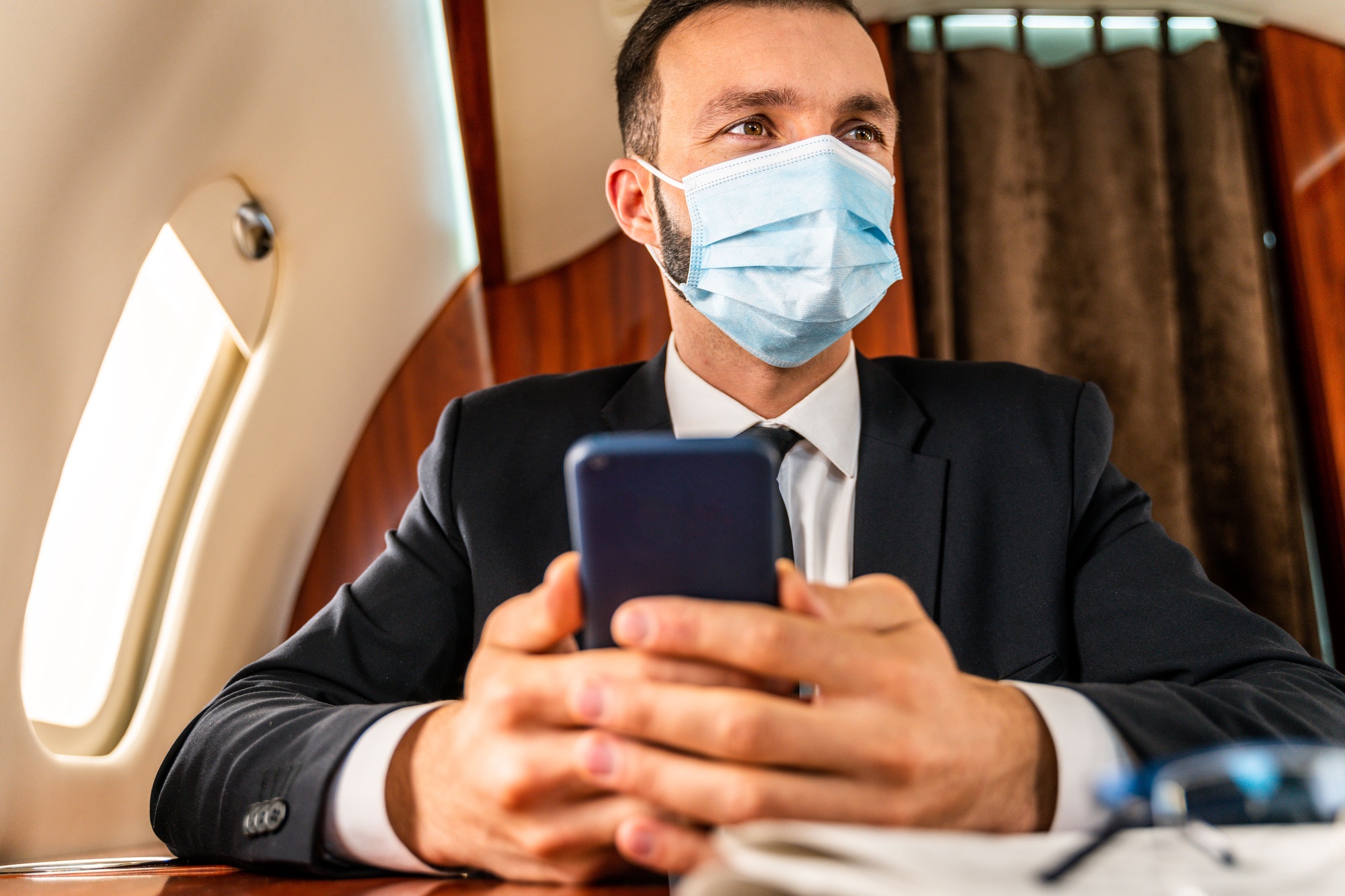 Businessman flying on private jet