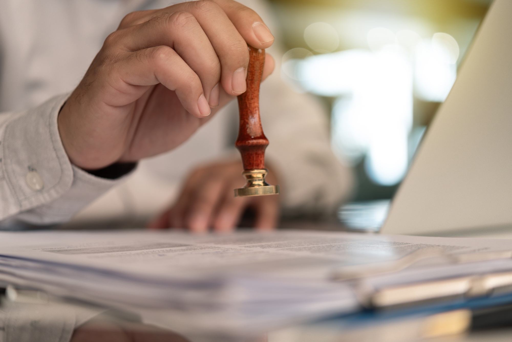 Businessman Stamping Approval on a Document certificate or Official