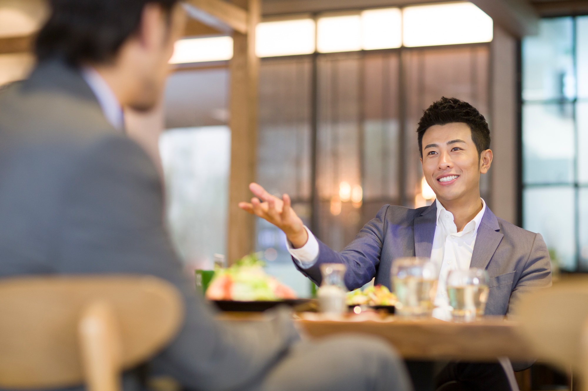 Businessmen having dinner together