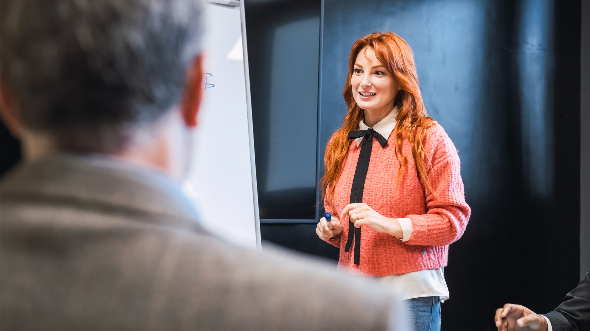 Businesswoman explaining strategy to colleague in conference room
