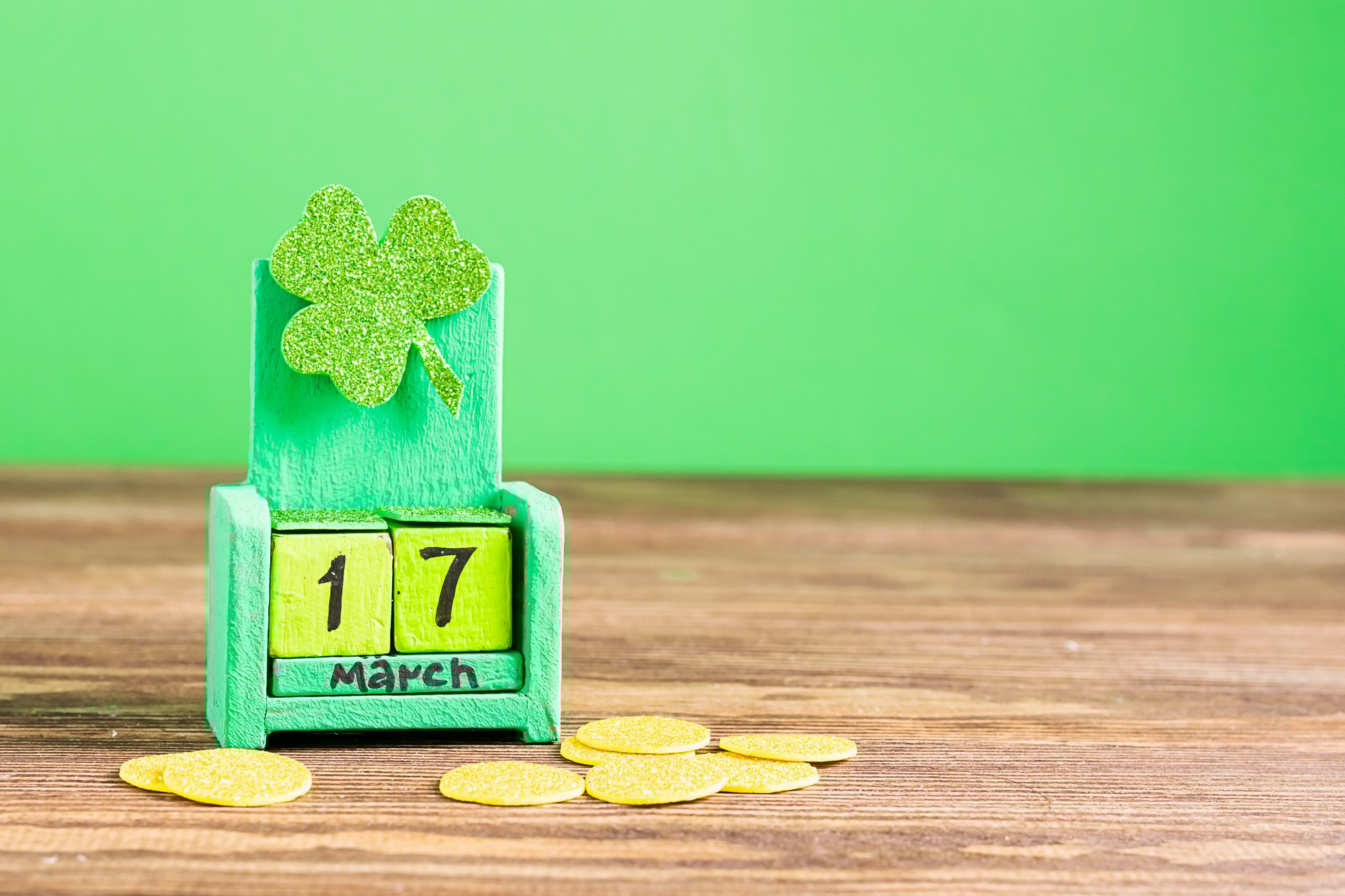 Calendar with date March 17. and shamrock clover green background. St. Patrick's Day concep.