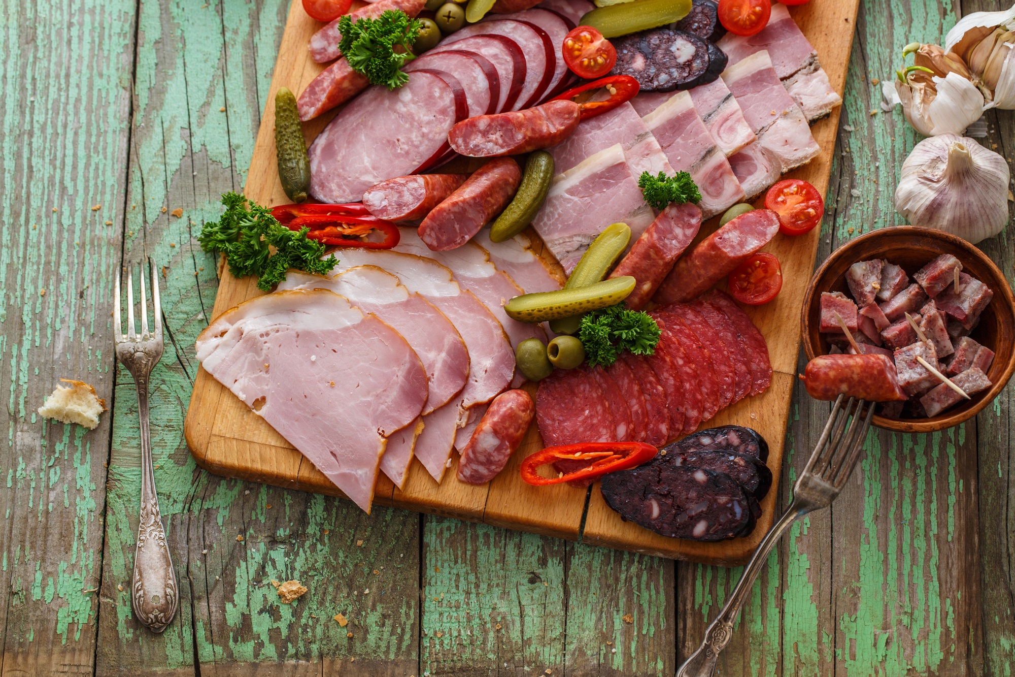 Charcuterie board with sausages and smoked meat. Top view