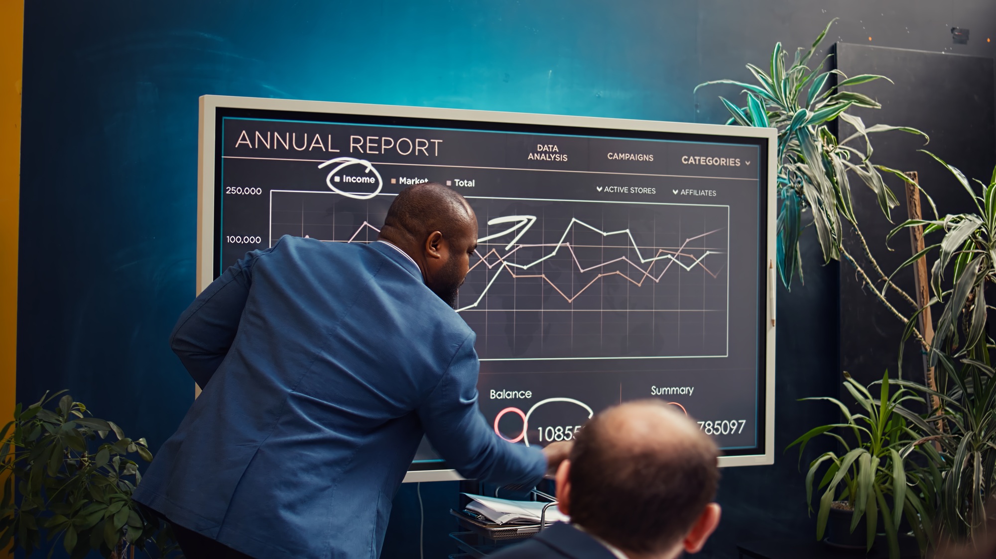 Chief operating officer presenting annual data reports in a conference room
