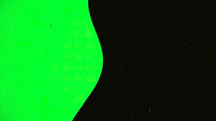 Colored background moves in wavy line on black background. Animation. Illusion of wavy movement of