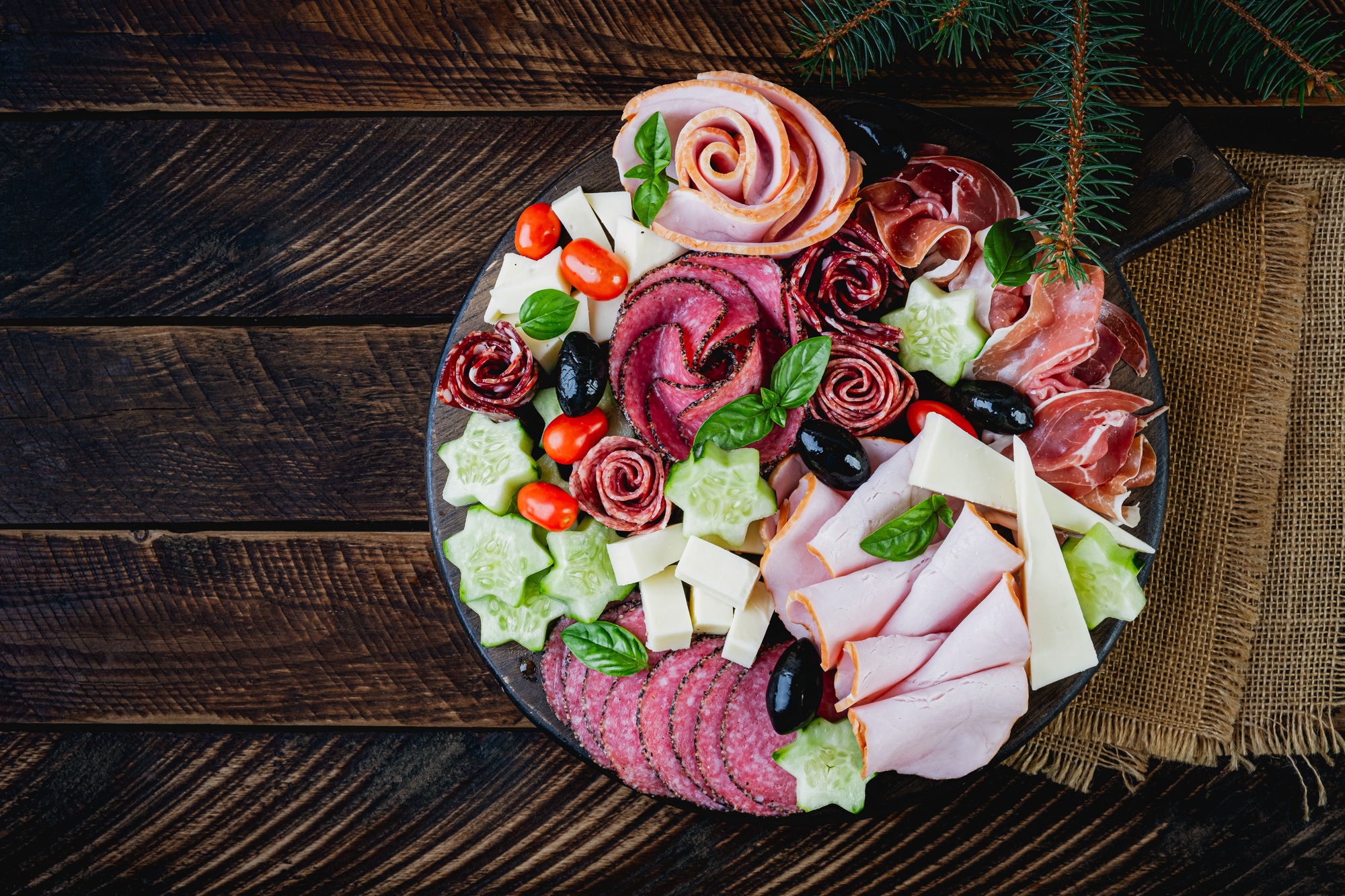 Colorful charcuterie boards and boxes vegetables, meat and cheese.