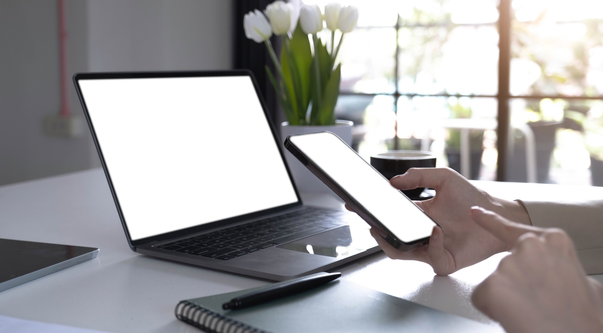 computer,cell phone mockup image blank screen with white background for advertising text,hand woman
