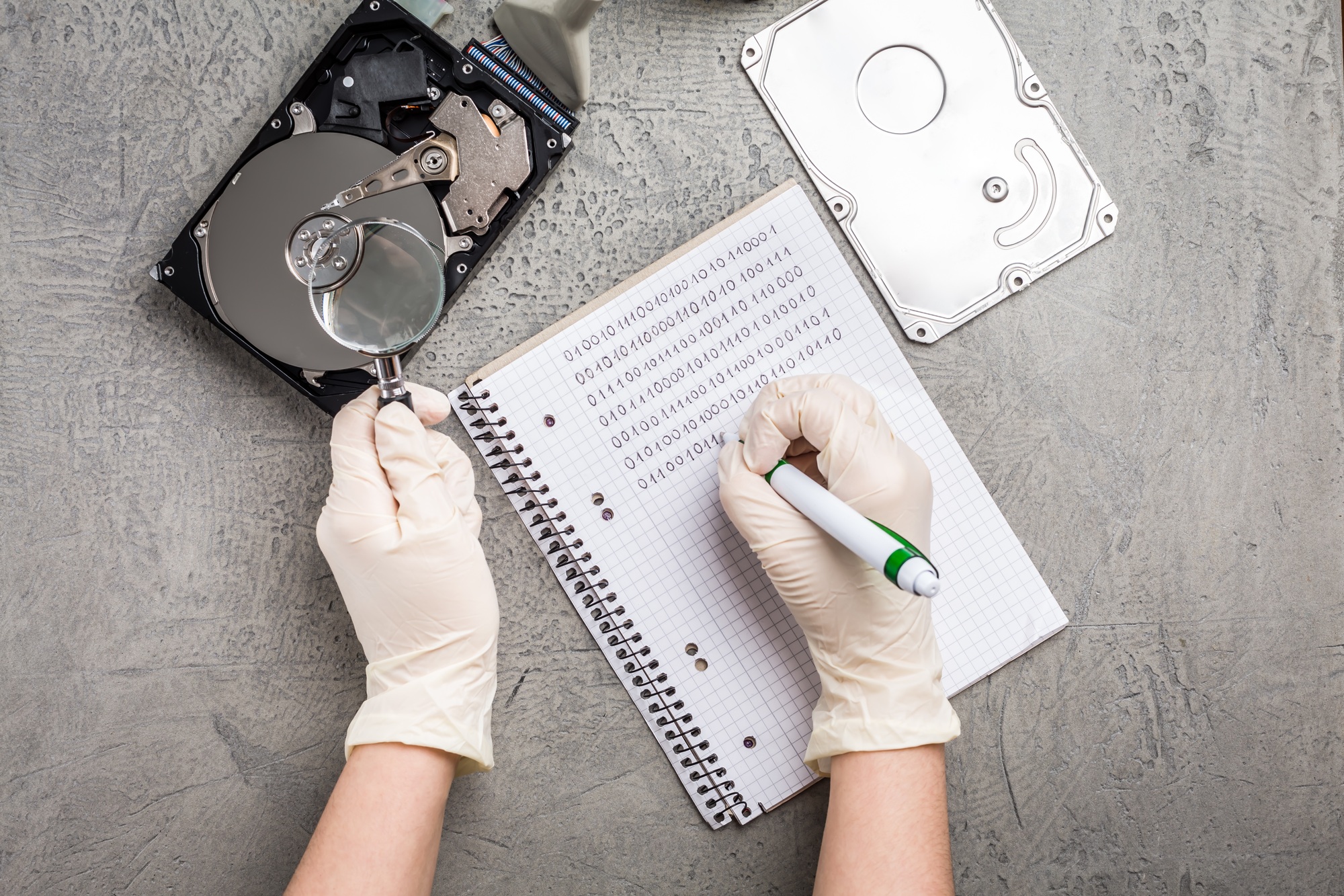 Concept of data recovery, engineer is recovering data from failed hard disk driver