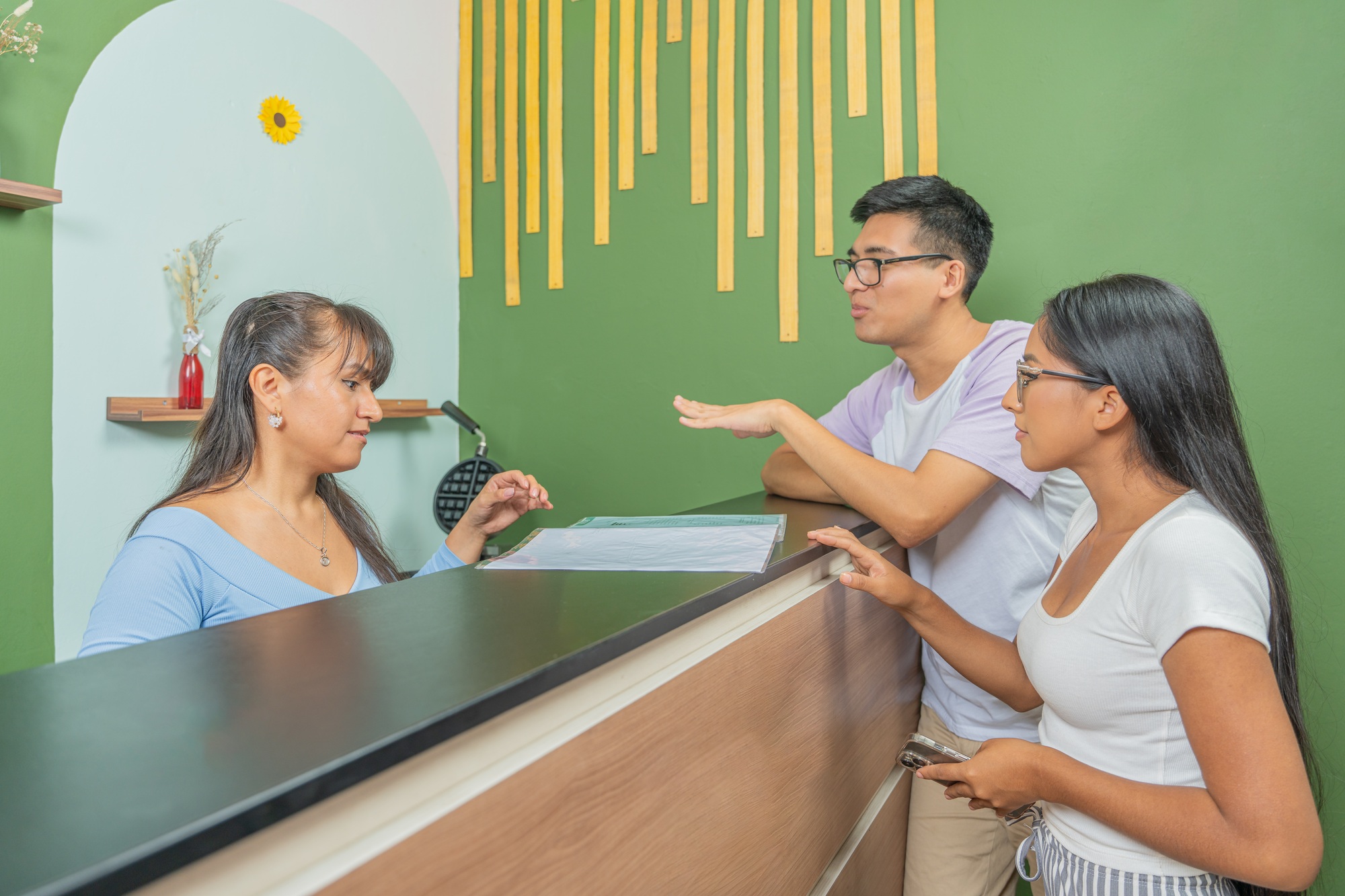 Couple paying at the cash register of the restaurant