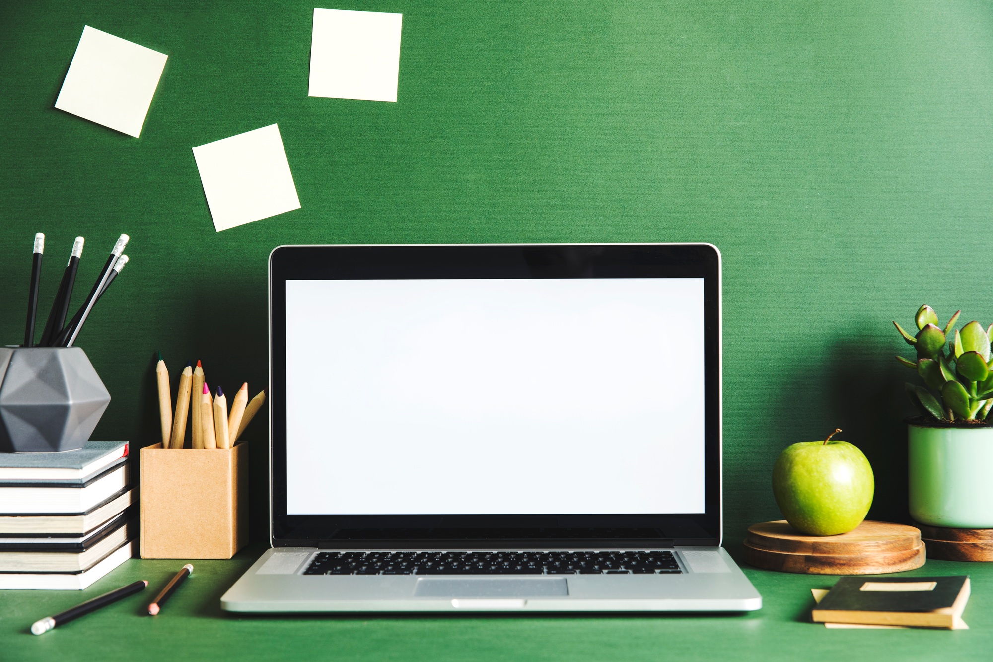 Creative desk with laptop mock up screen