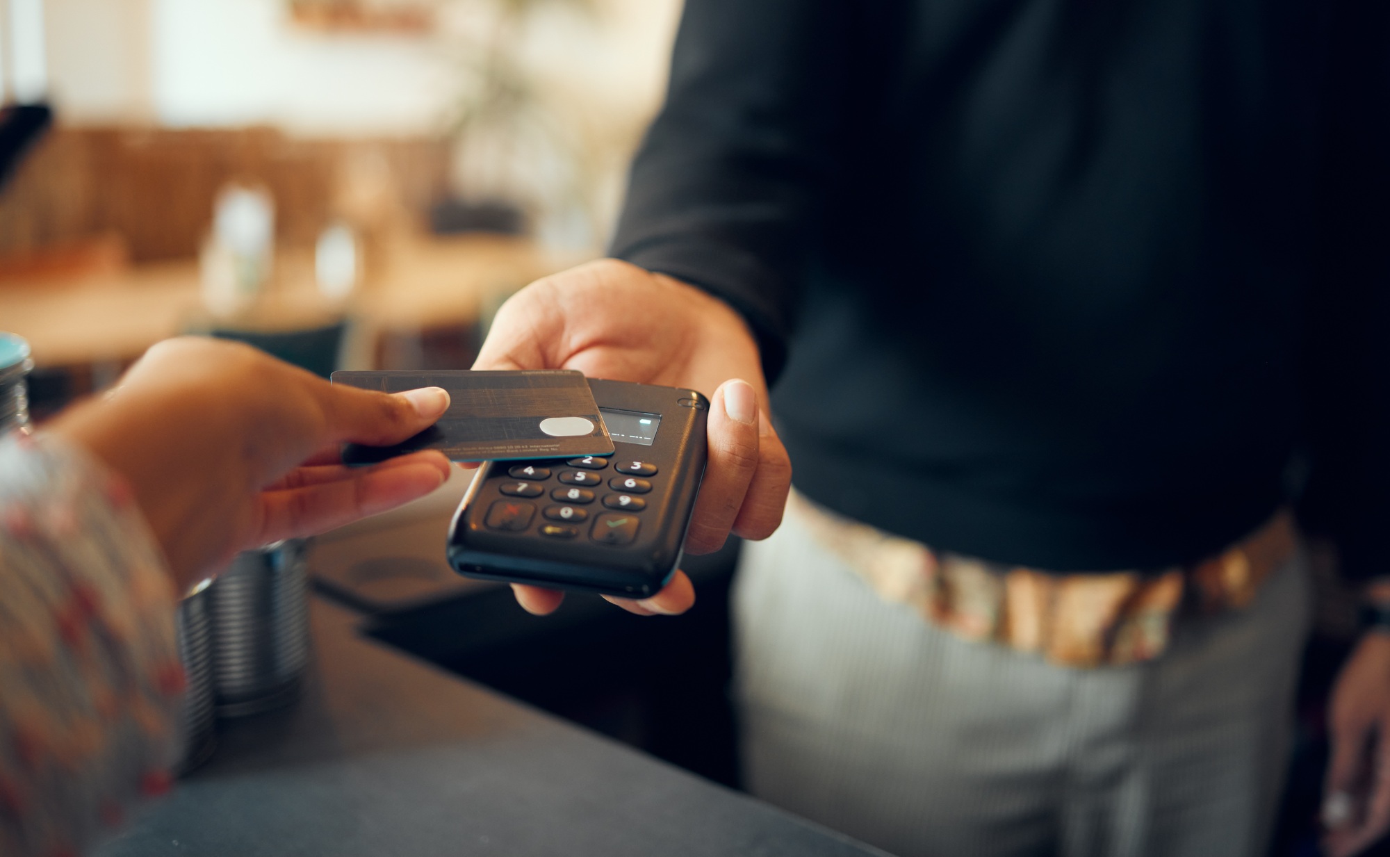Credit card payment, pos and customer hands, store cashier or restaurant waiter with easy point of