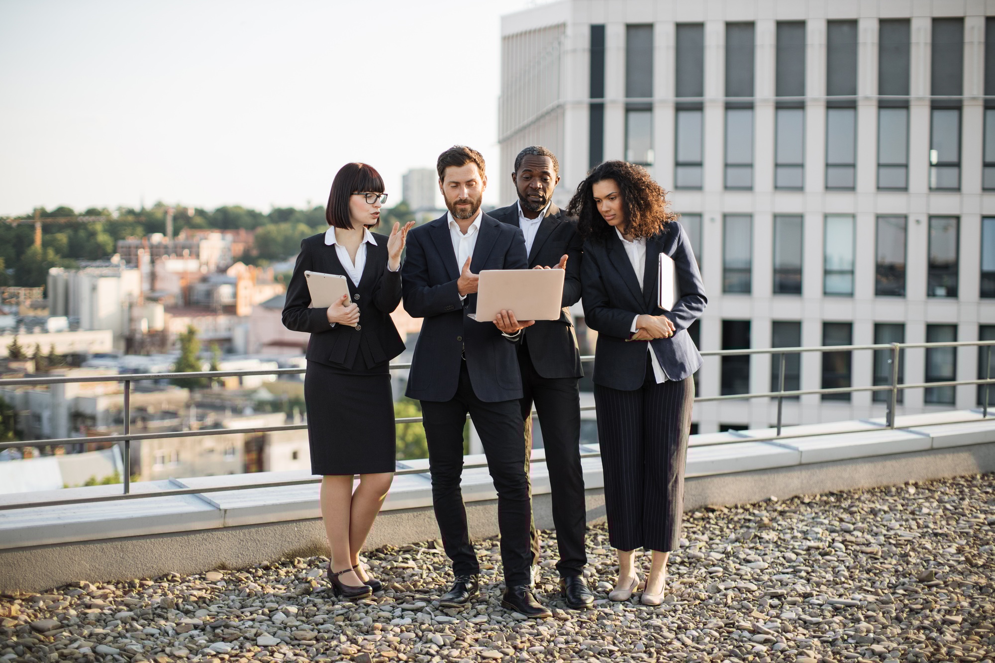 Diverse financiers discussing marketing strategies outdoors