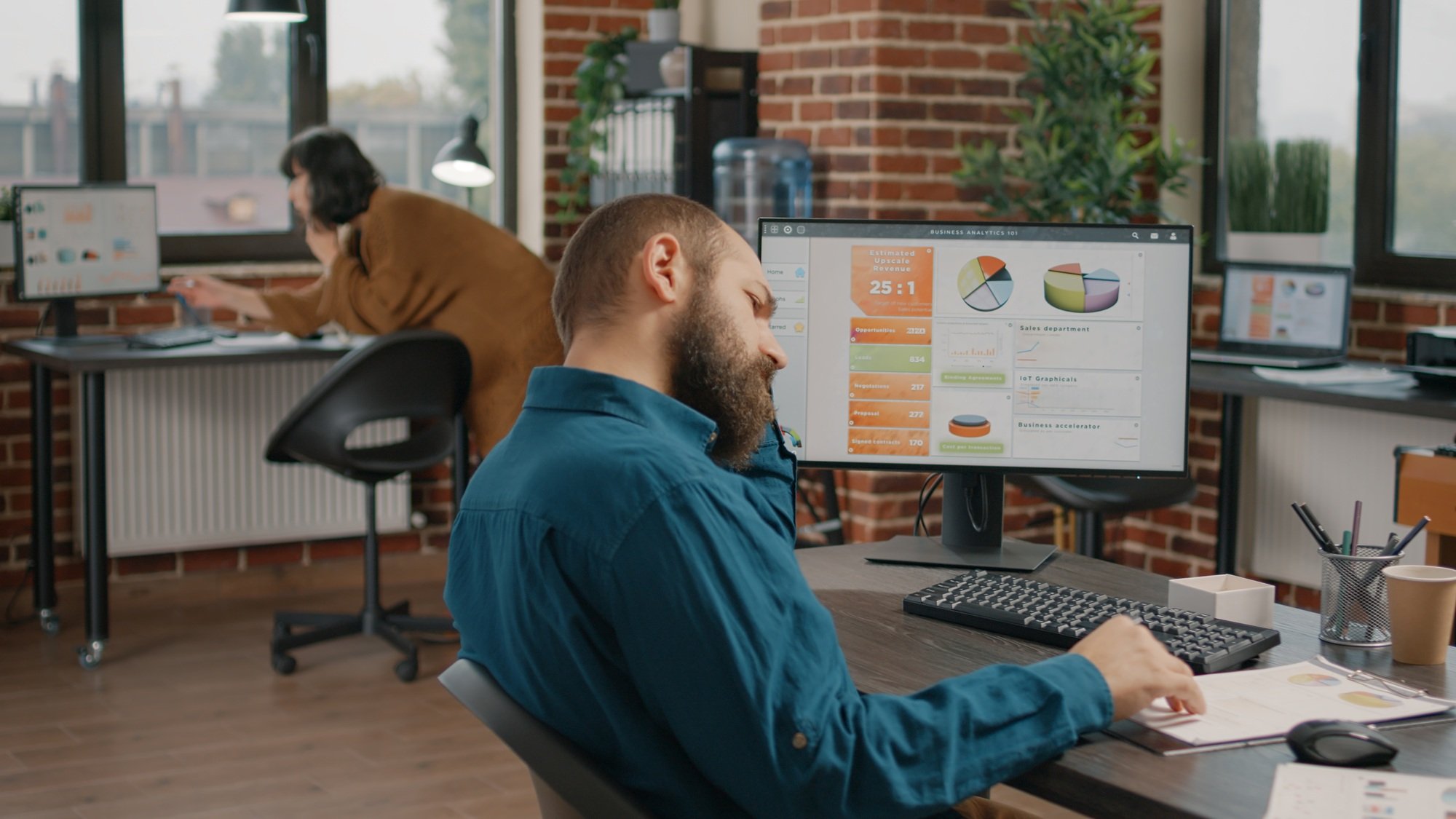 Entrepreneur working on business rate charts design