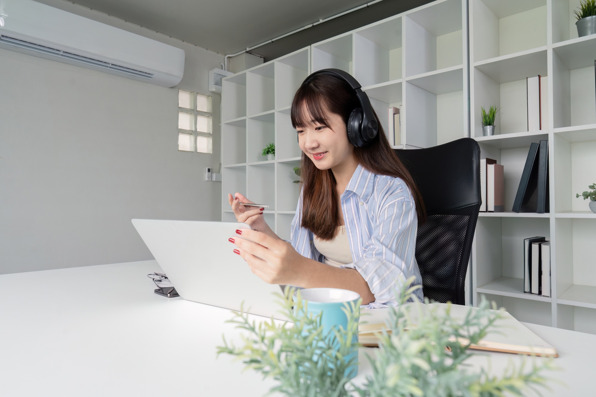 Focused Woman Engaging in Online Study Session at Home