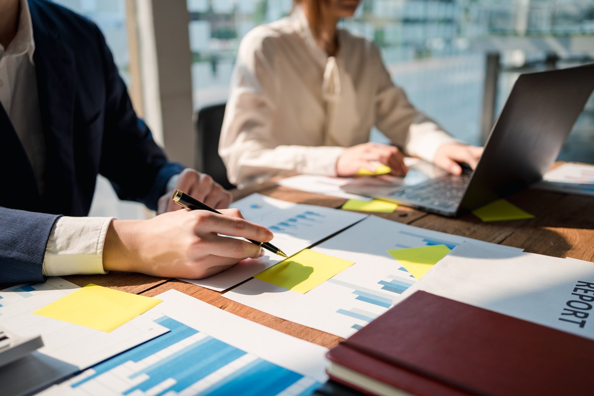 Group of businessmen explaining the concept marketing strategy analyze graphs and charts