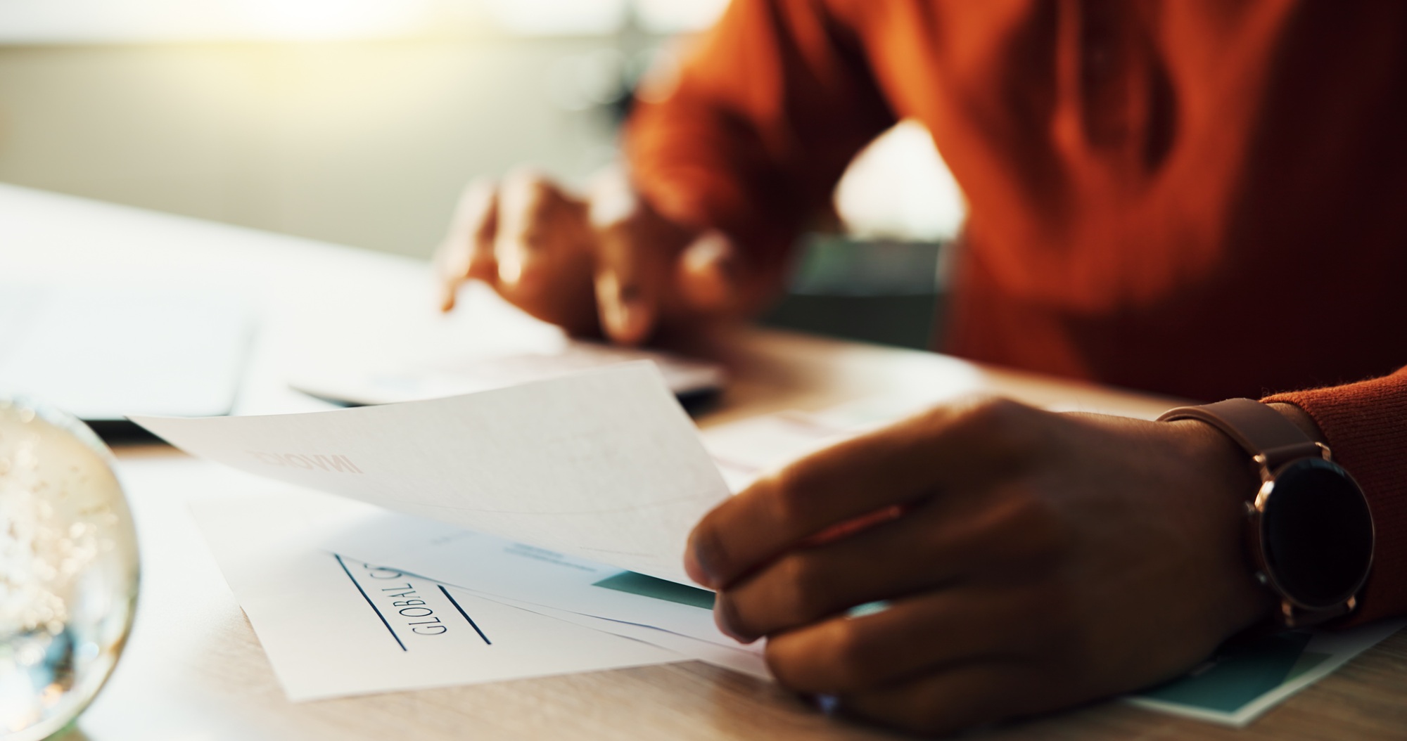 Hands, person and documents with calculator for finance payments, mortgage invoice and bank stateme