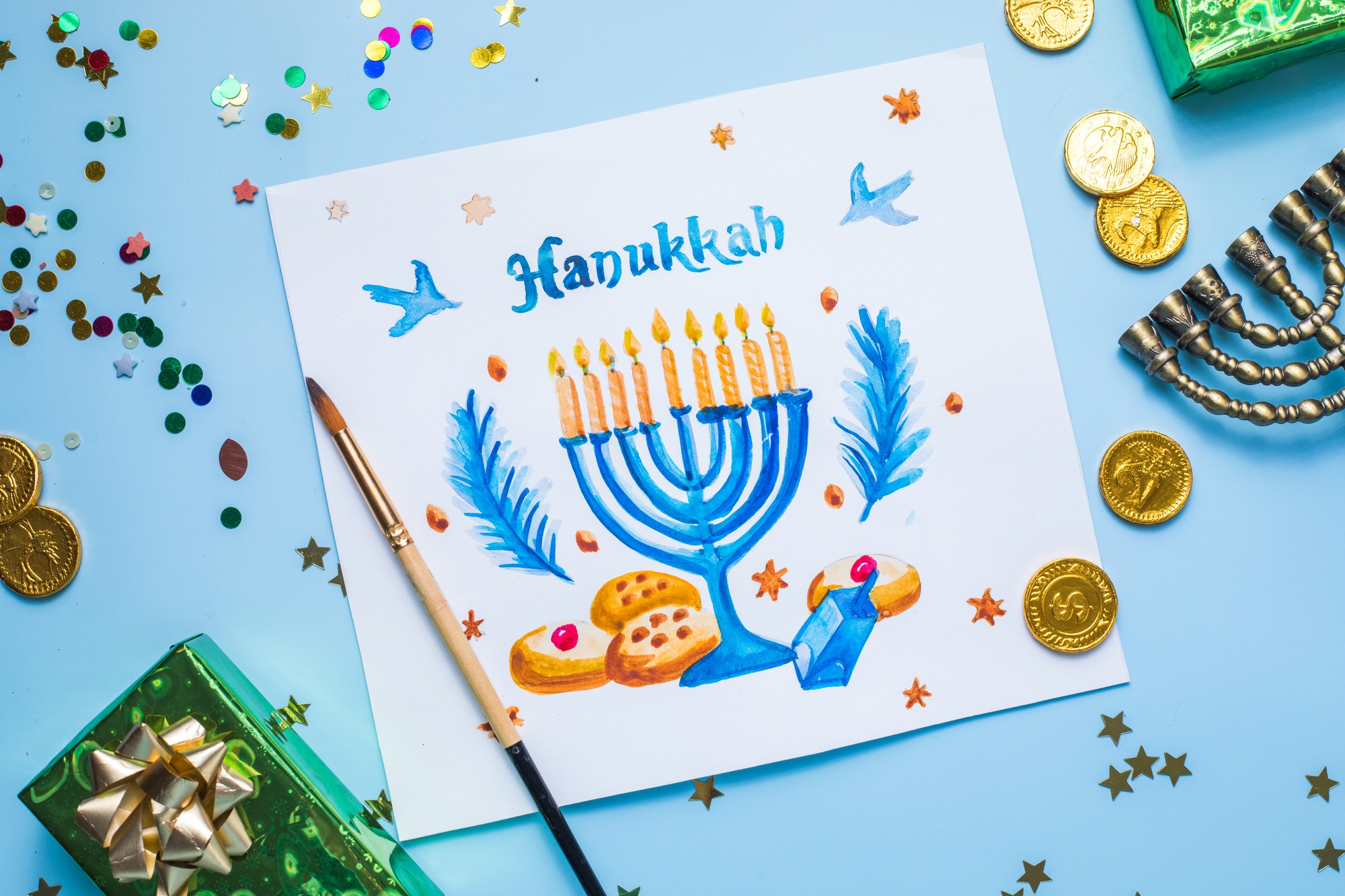 Hanukkah symbols flat lay. Traditional jewish holiday greeting card design with happy hanukkah
