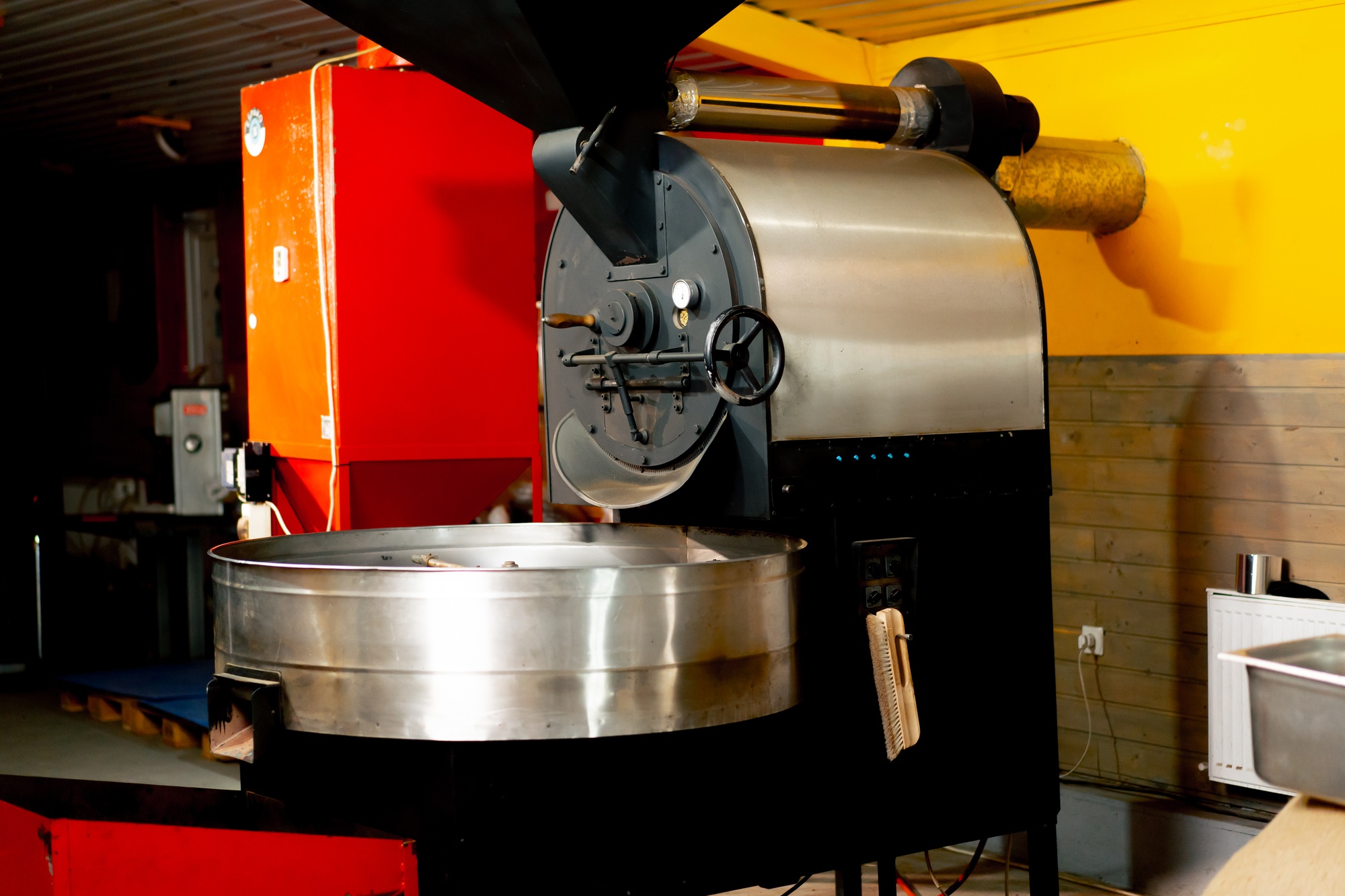 in a small coffee roasting factory machine roasts coffee specialized production