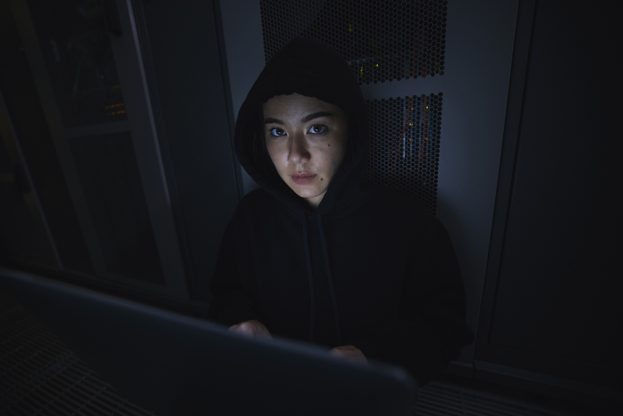 Laptop, hacker and server with portrait of woman for coding, software and cyber security. Ransomwar