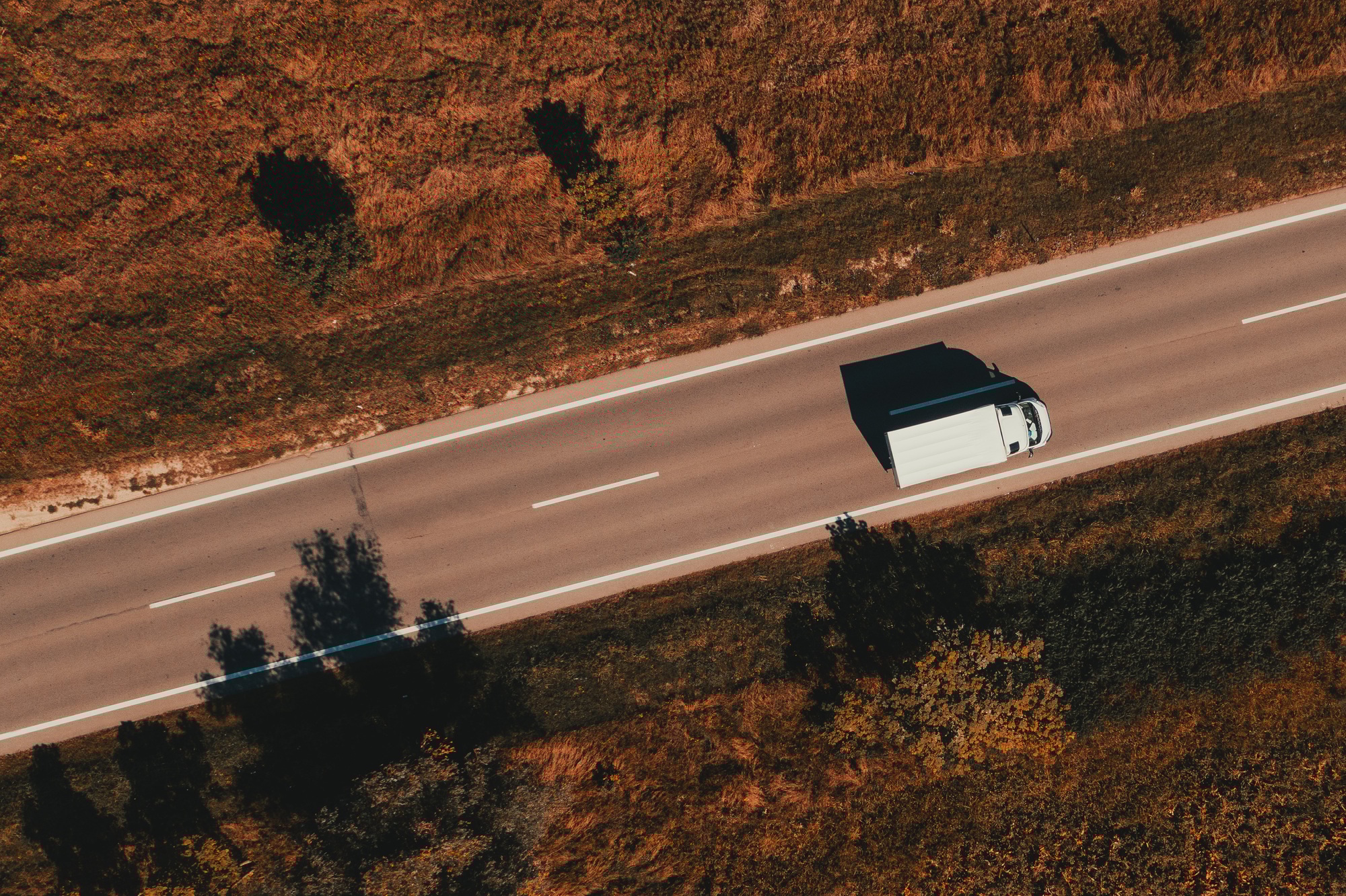 Lorry truck on the road, top down drone photography