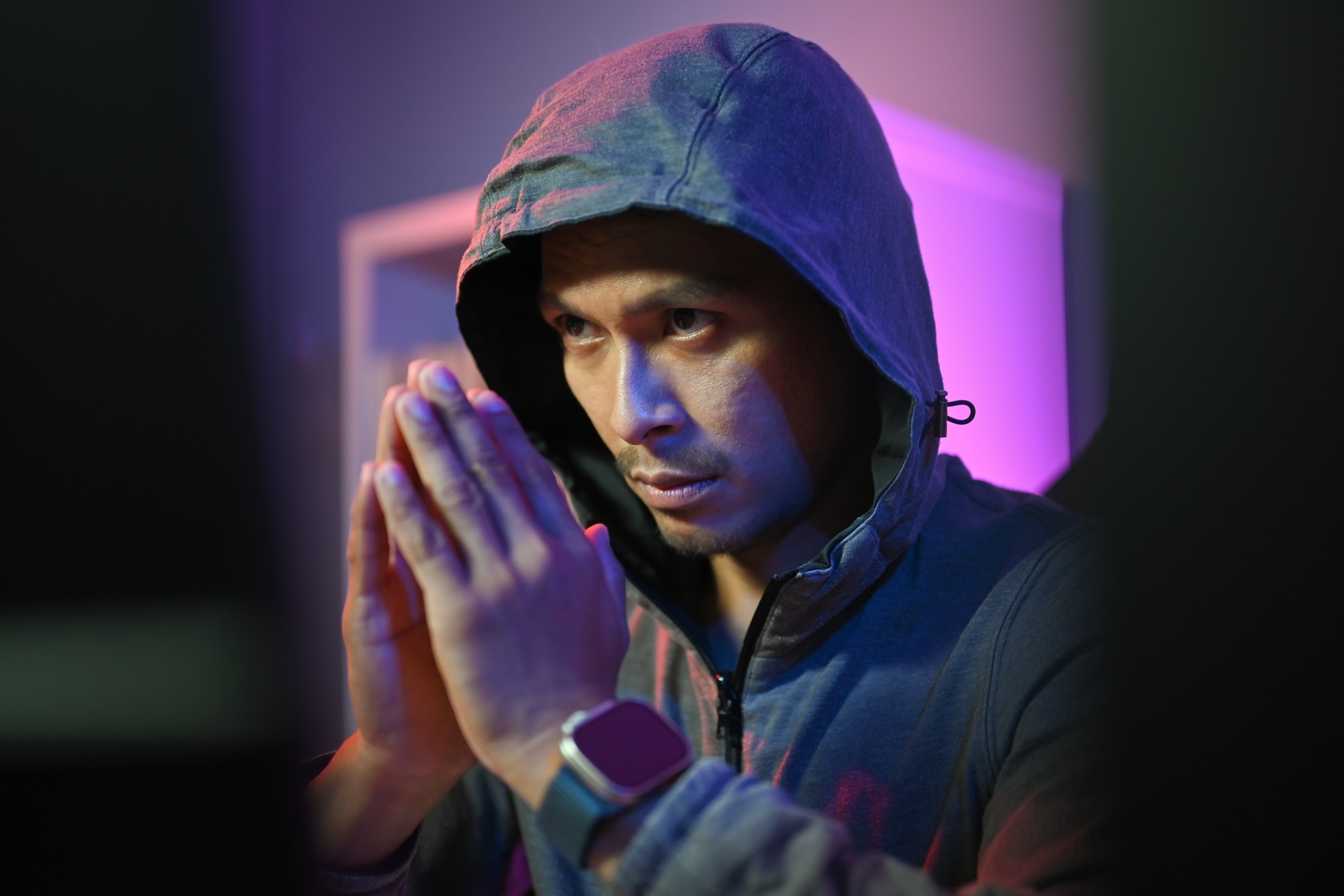 Male hacker in hoodie using computer for attack security to data digital internet network system.