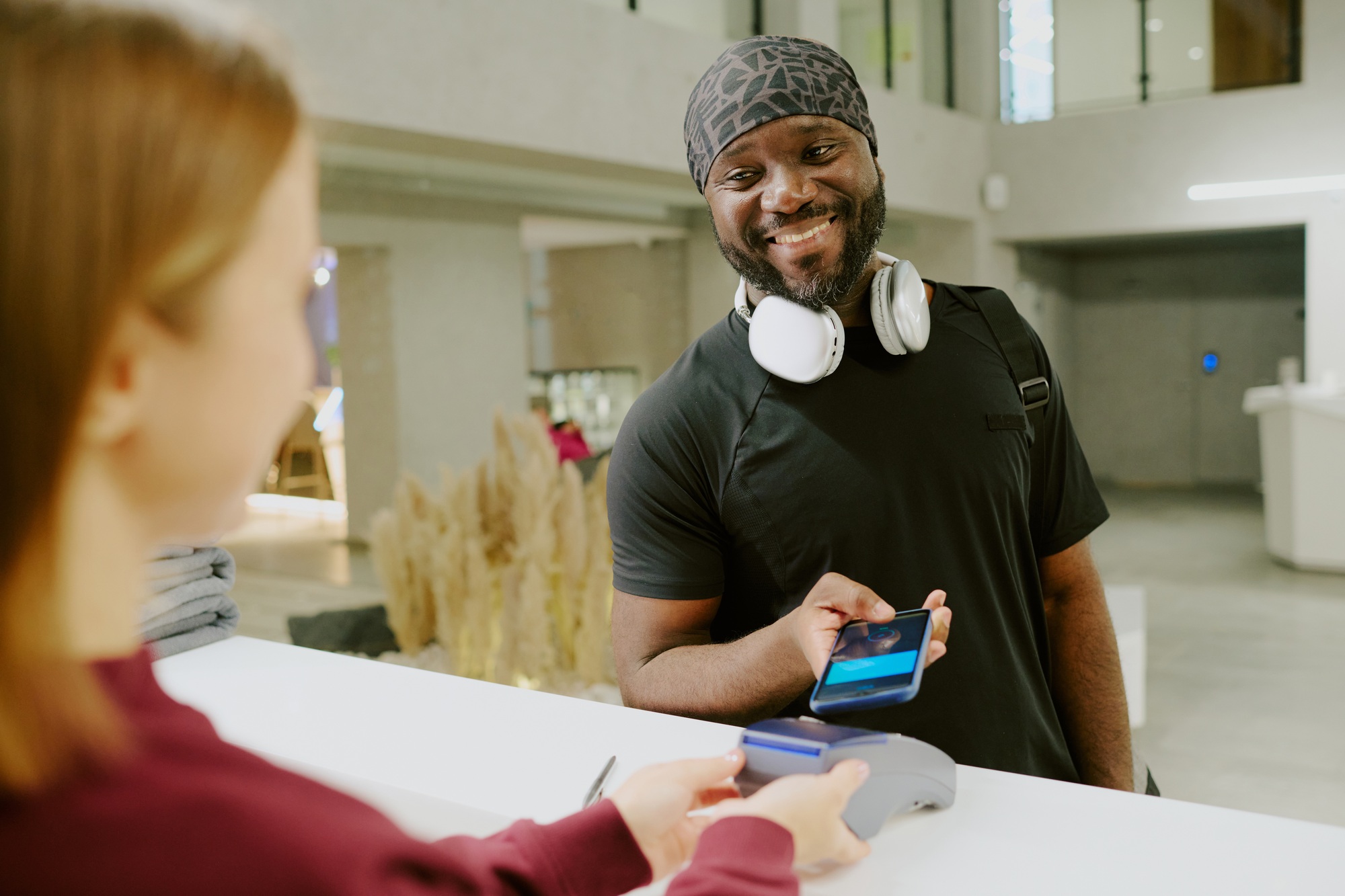 Man Paying for Gym Membership