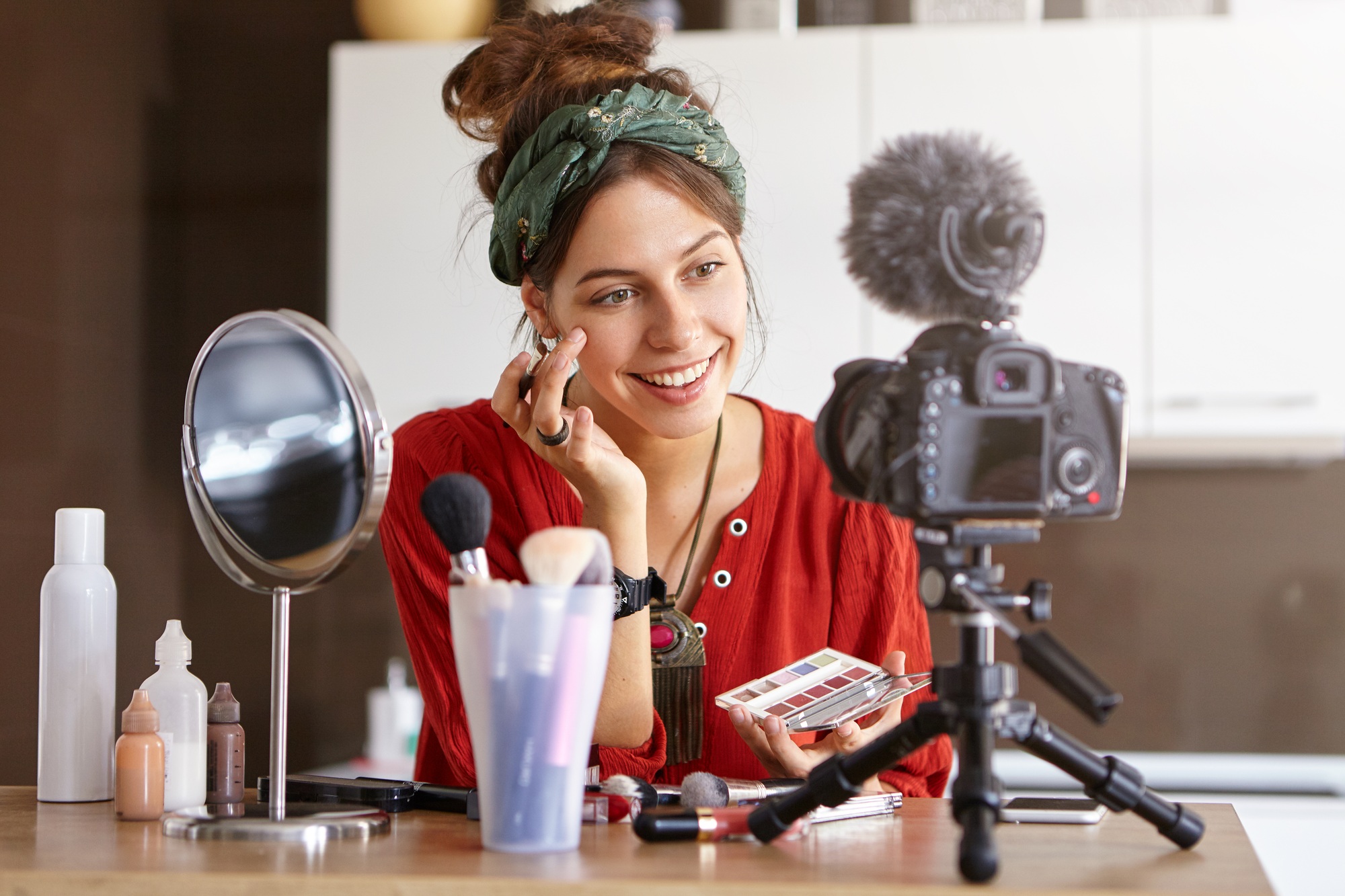 Massmedia, e-commerce and modern technology concept. Beautiful young woman vlogger celebrity working