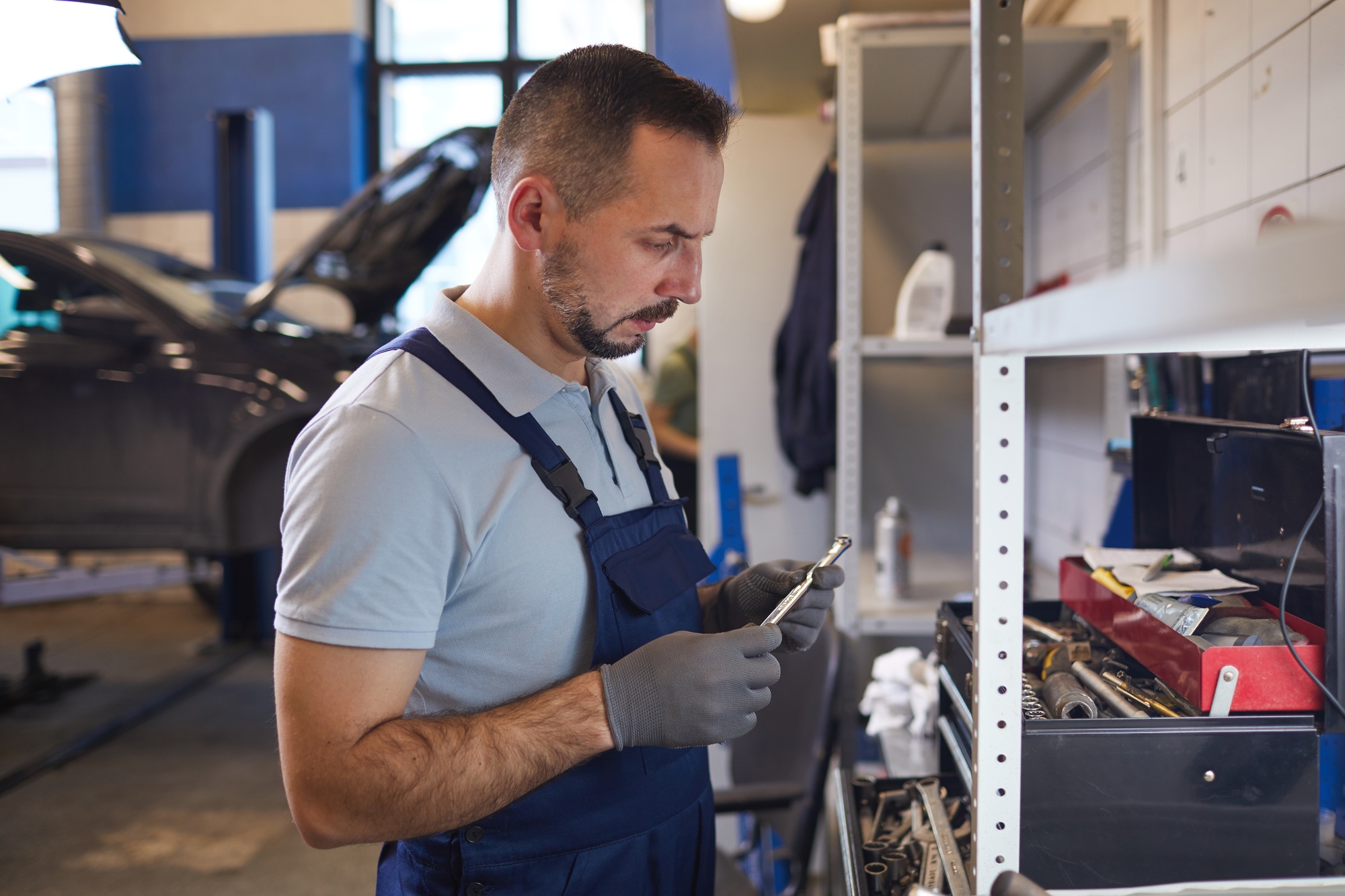 Mechanic Choosing Tools