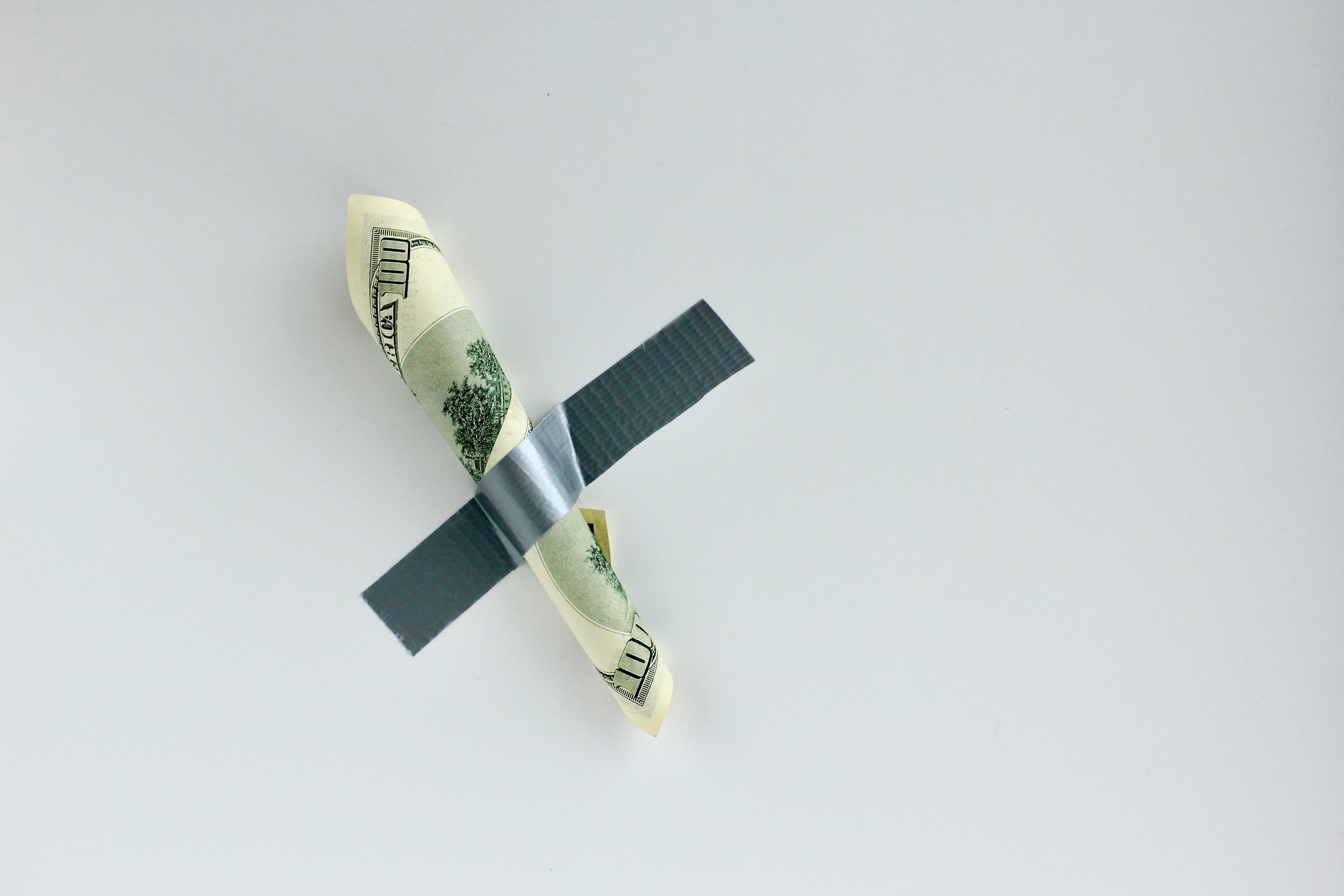Money duct taped to the wall.Conceptual photo. Background for sticker, t-shirt screen printing.