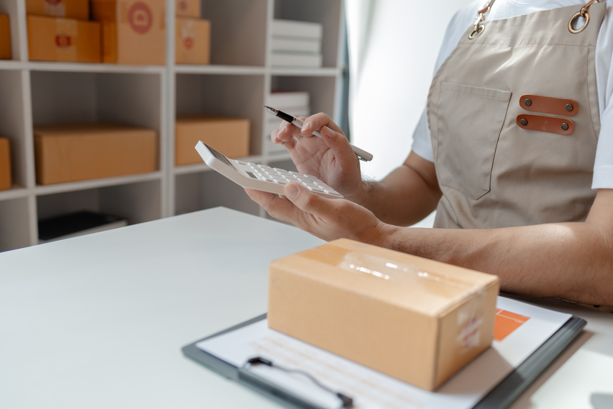 packs products for delivery to addresses via private courier service. Product packaging concept, he