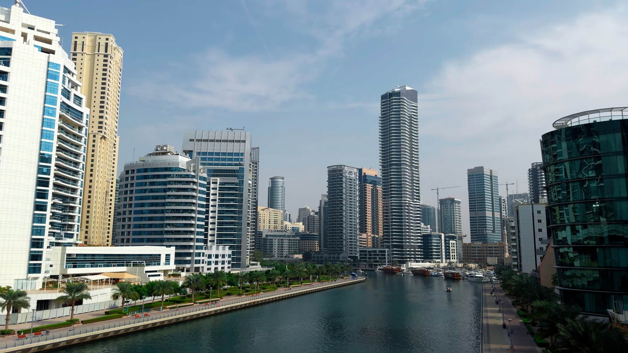 Panoramic view of high buildings with glass facade. Action. Real estate business in united arab