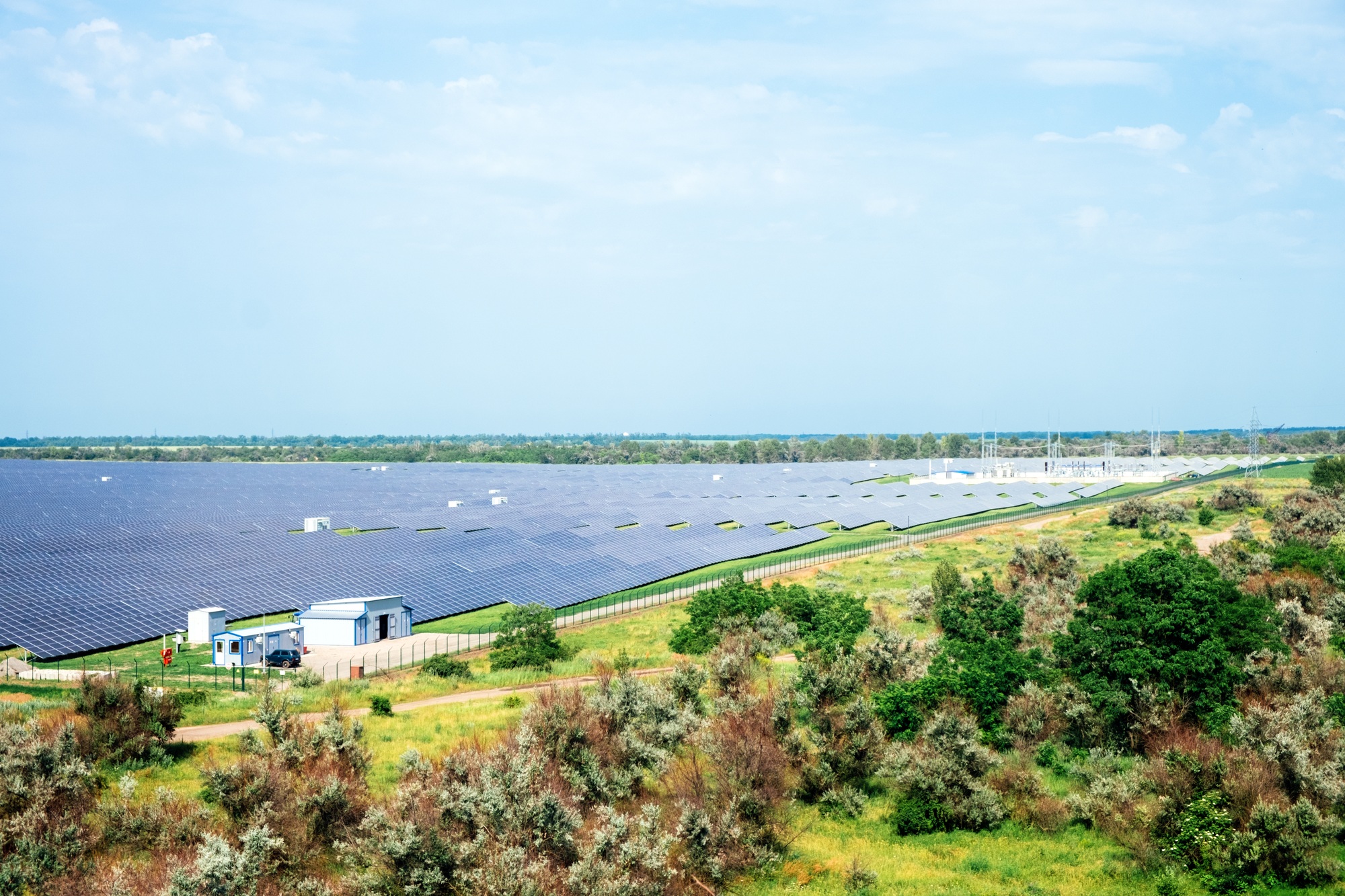 Panoramic view of photovoltaic power station, solar park, solar farm, solar power plant.