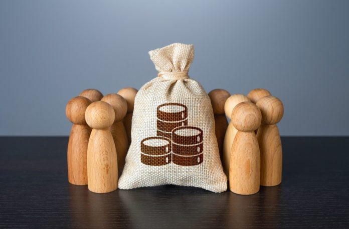 People gather around money bag. Financial support.