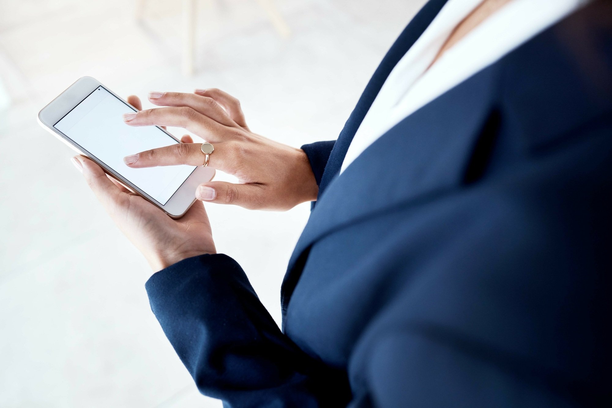 Phone, mockup and hands of business woman texting, advertising and copy space on white background.