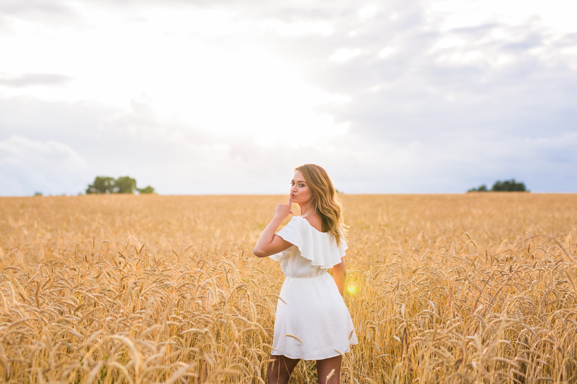 Quiet, secret and trust concept. Woman hand with silence sign symbol on nature