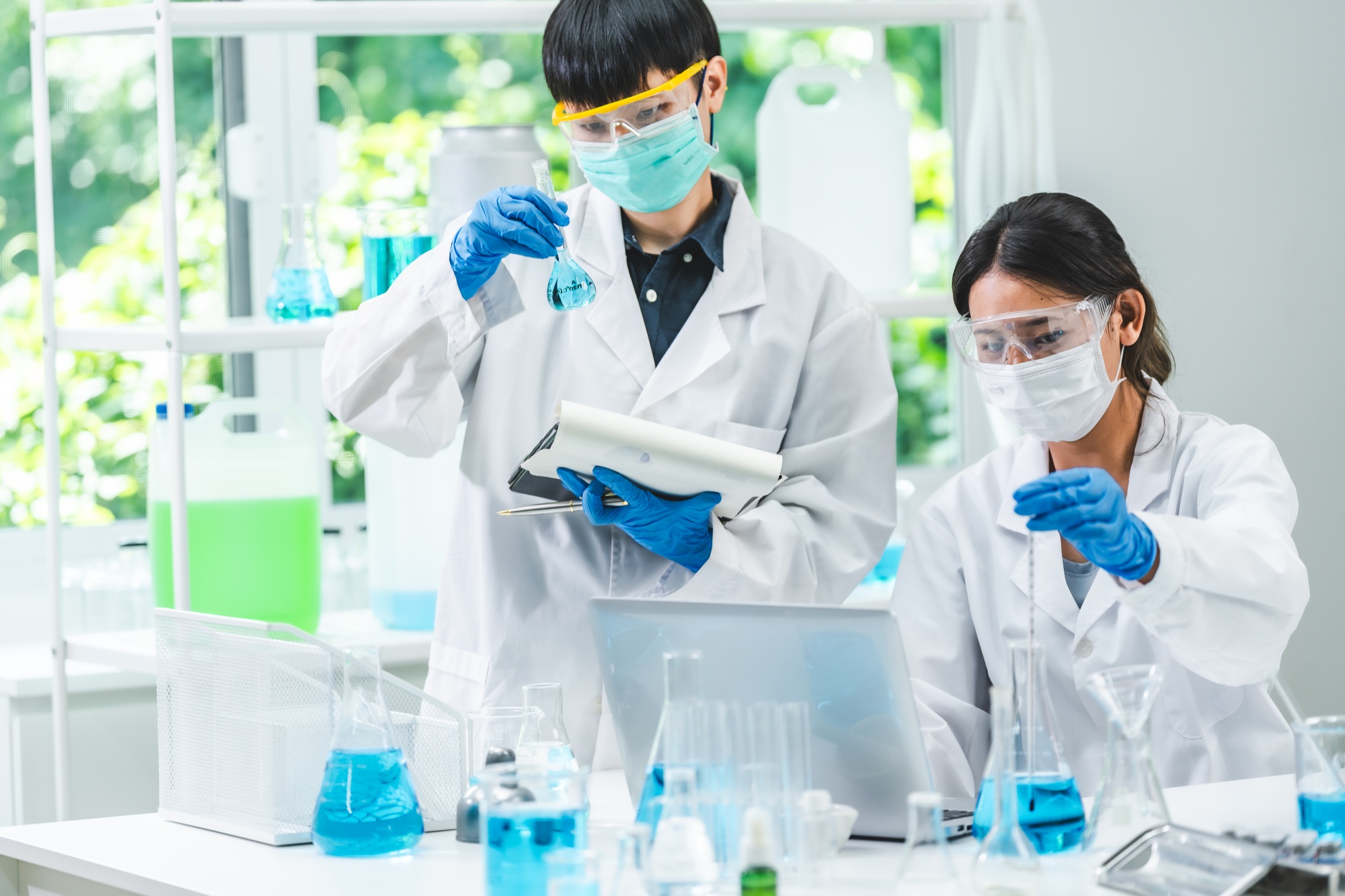 researcher working in laboratory for medicals science research using scientific equipment technology