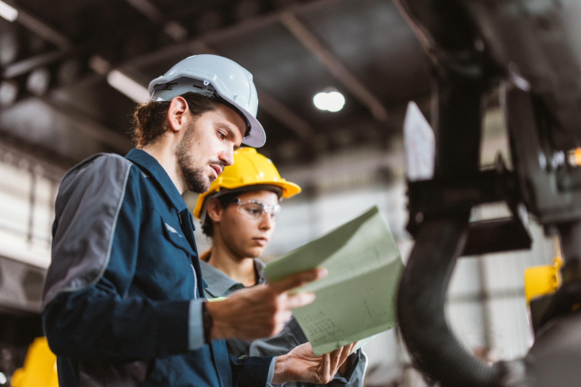 Robotic techs remotely check circuit boards in robot arms, find issues, and report to supervisors.