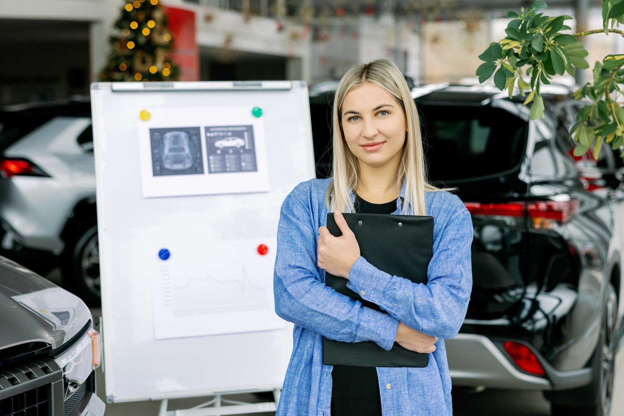 Saleswoman showing infographic during presentation about automotive suspension performance