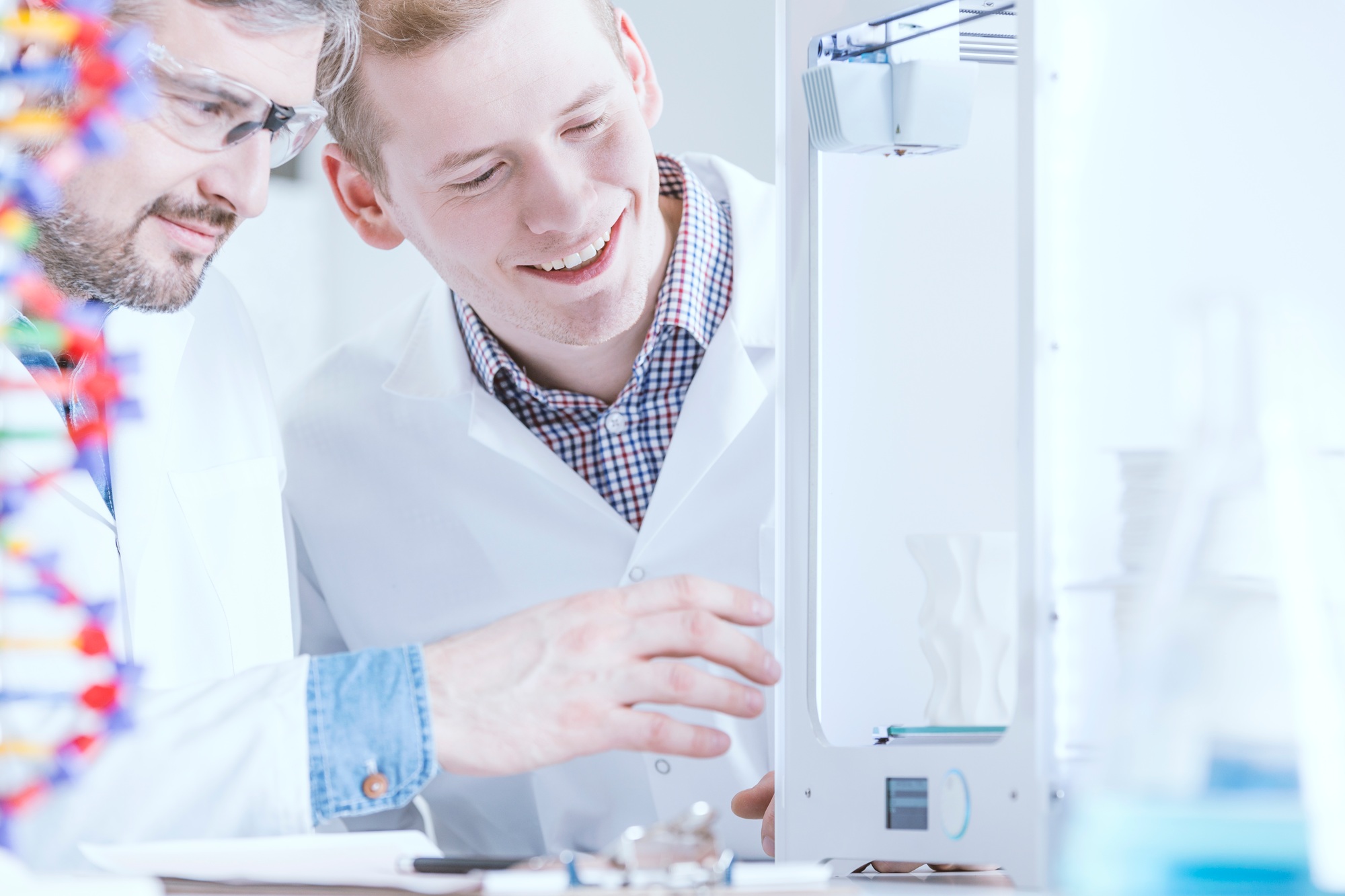 Scientists observing the 3D print
