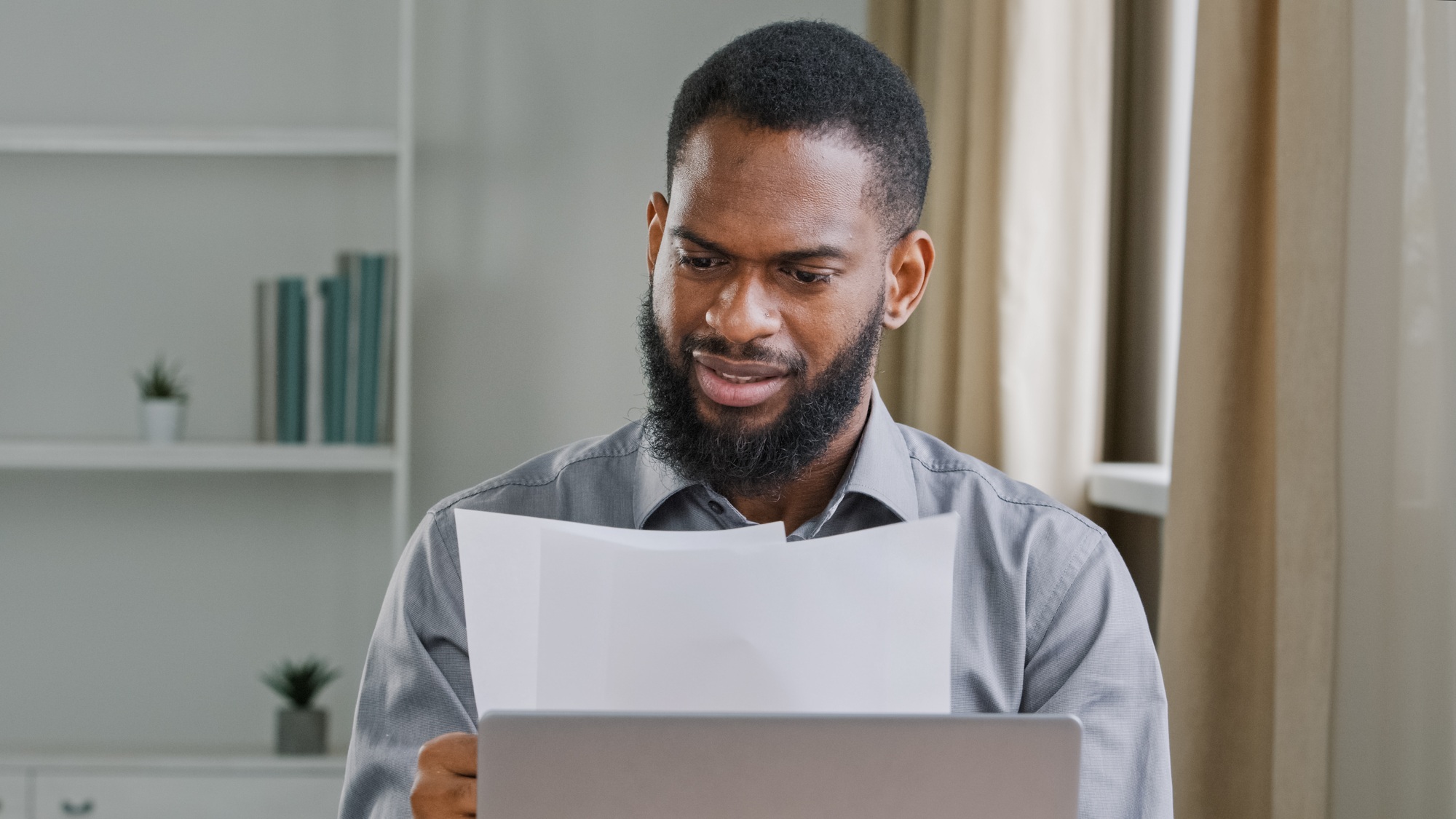 Serious African American man ethnic bearded businessman boss entrepreneur bookkeeper executive in