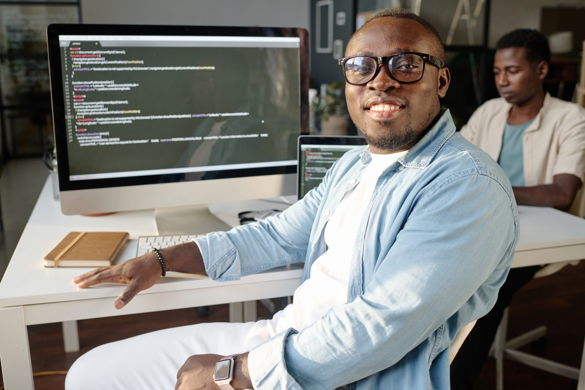 Smiling Developer Looking at Camera