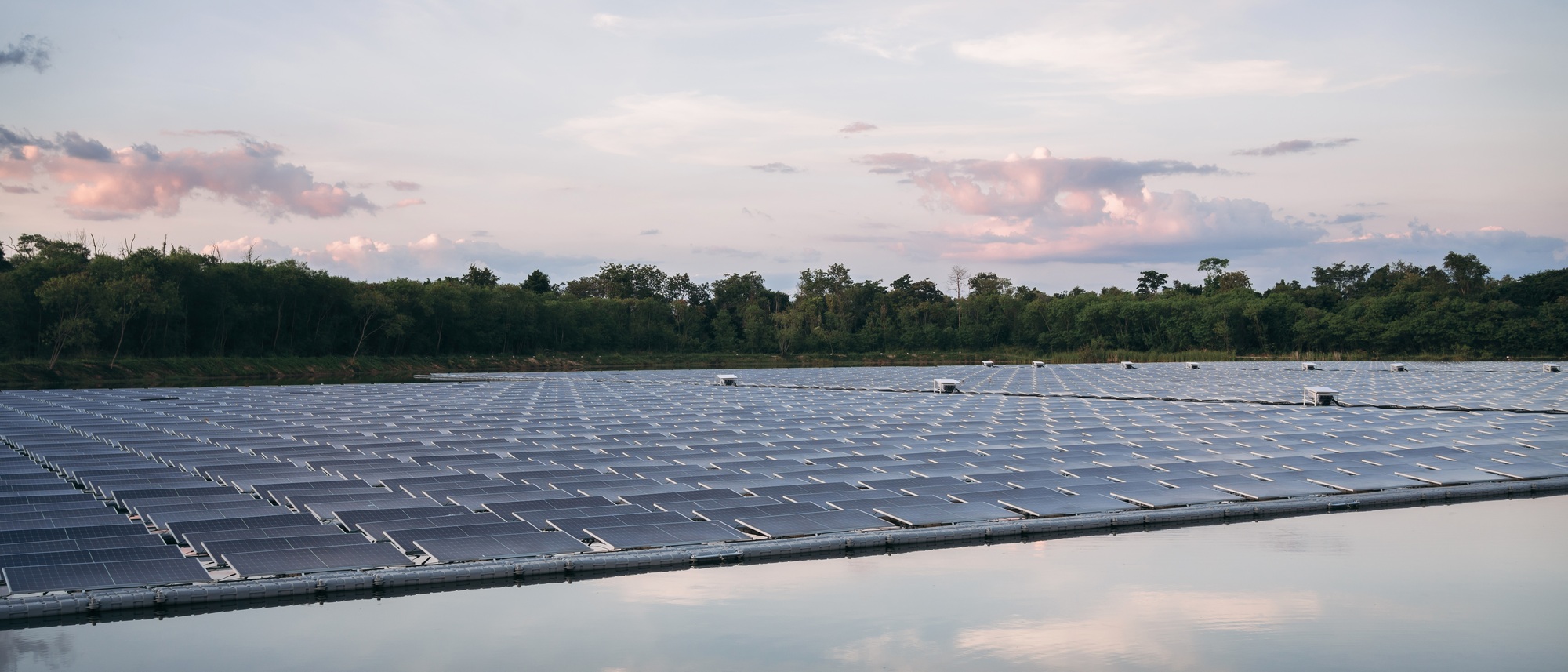 Solar power plant farm situated on a beautiful lake