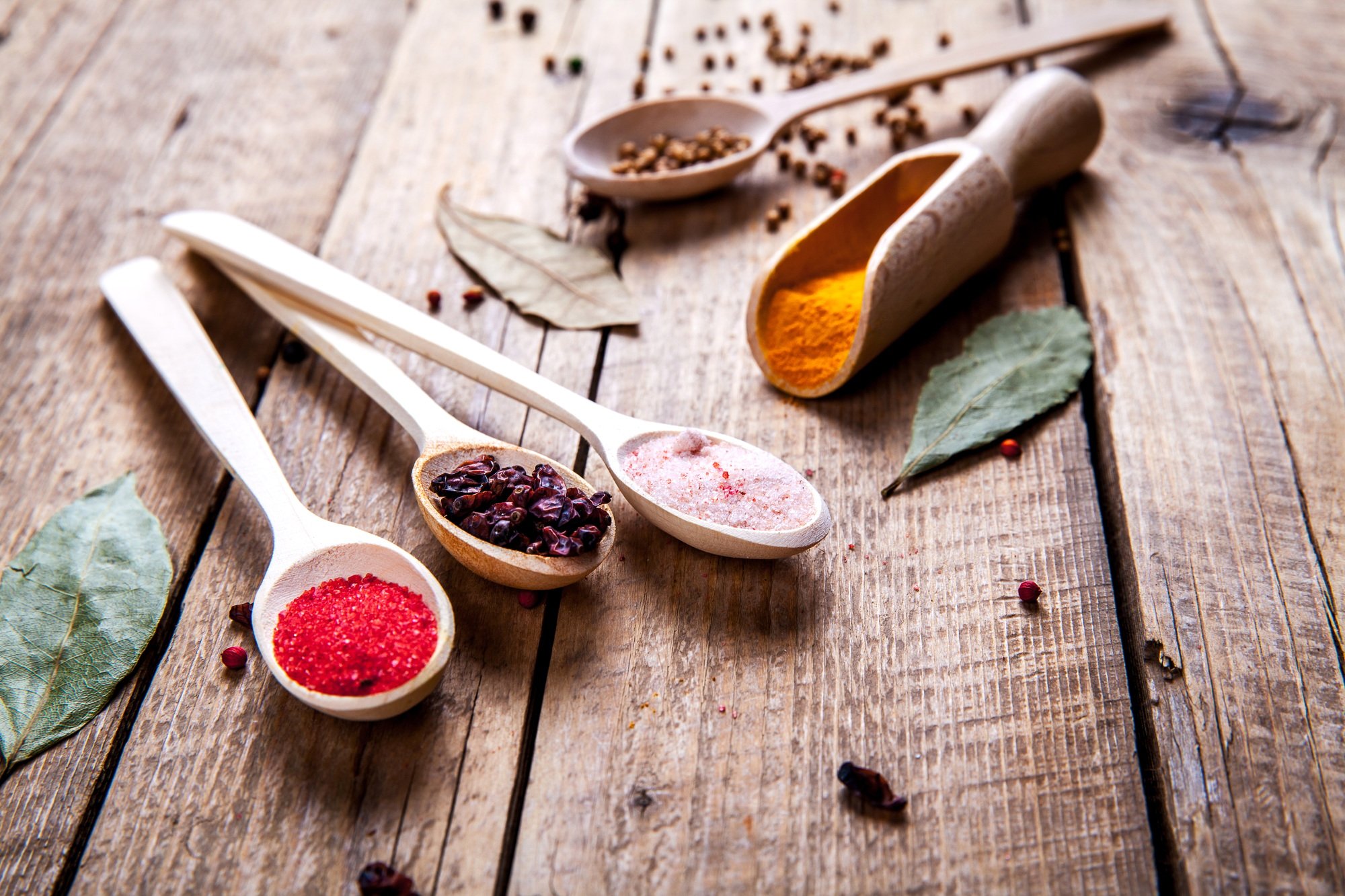 Spices on wooden background. With empty space for advertising text