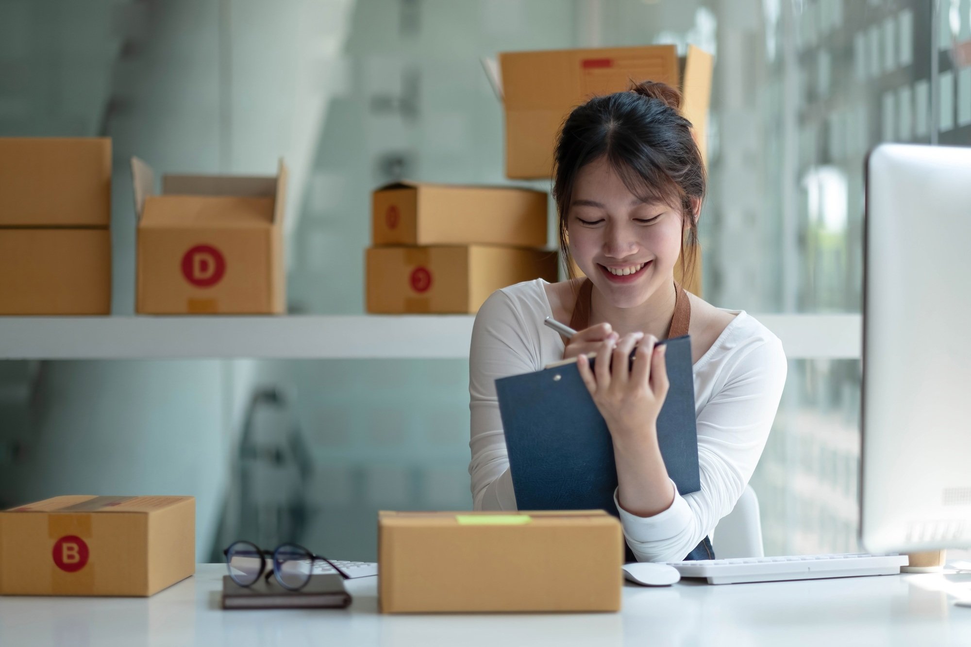 Starting Small business entrepreneur freelance,Portrait young woman working at home office, BOX