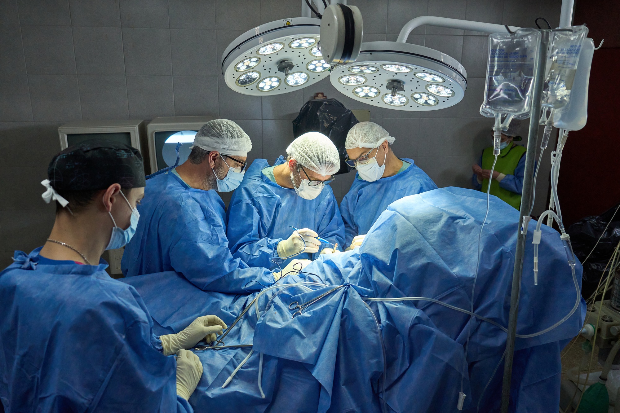 Surgical Team Performing Procedure in Hospital Operating Room