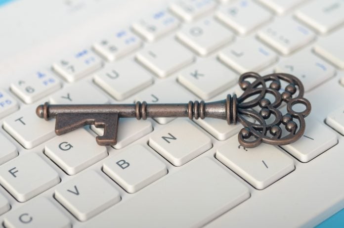 the key and the keyboard highlights the importance of cybersecurity and protecting sensitive data.